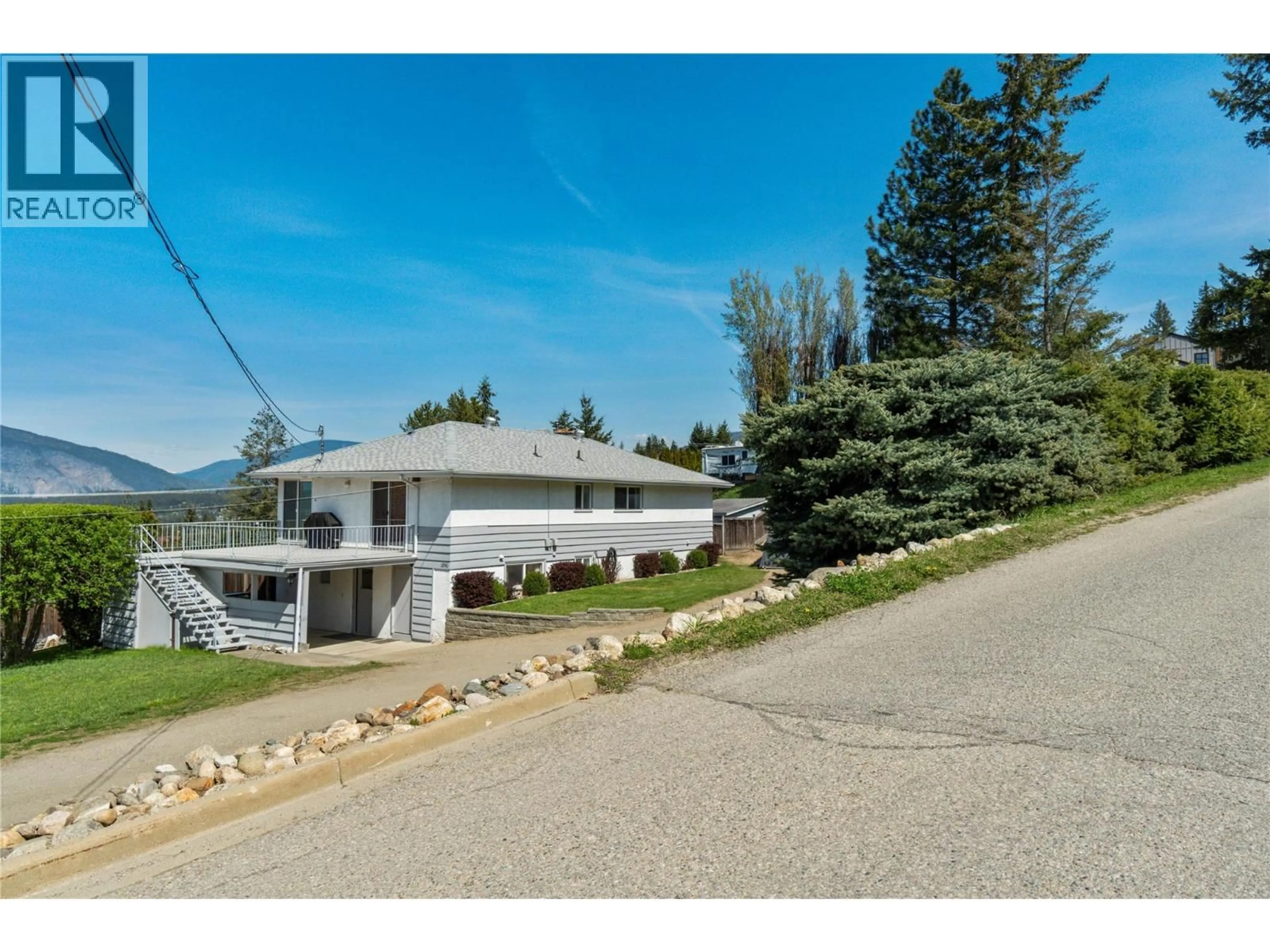 A pic from outside/outdoor area/front of a property/back of a property/a pic from drone, mountain view for 1290 15 STREET SOUTHEAST, Salmon Arm British Columbia V1E2G8