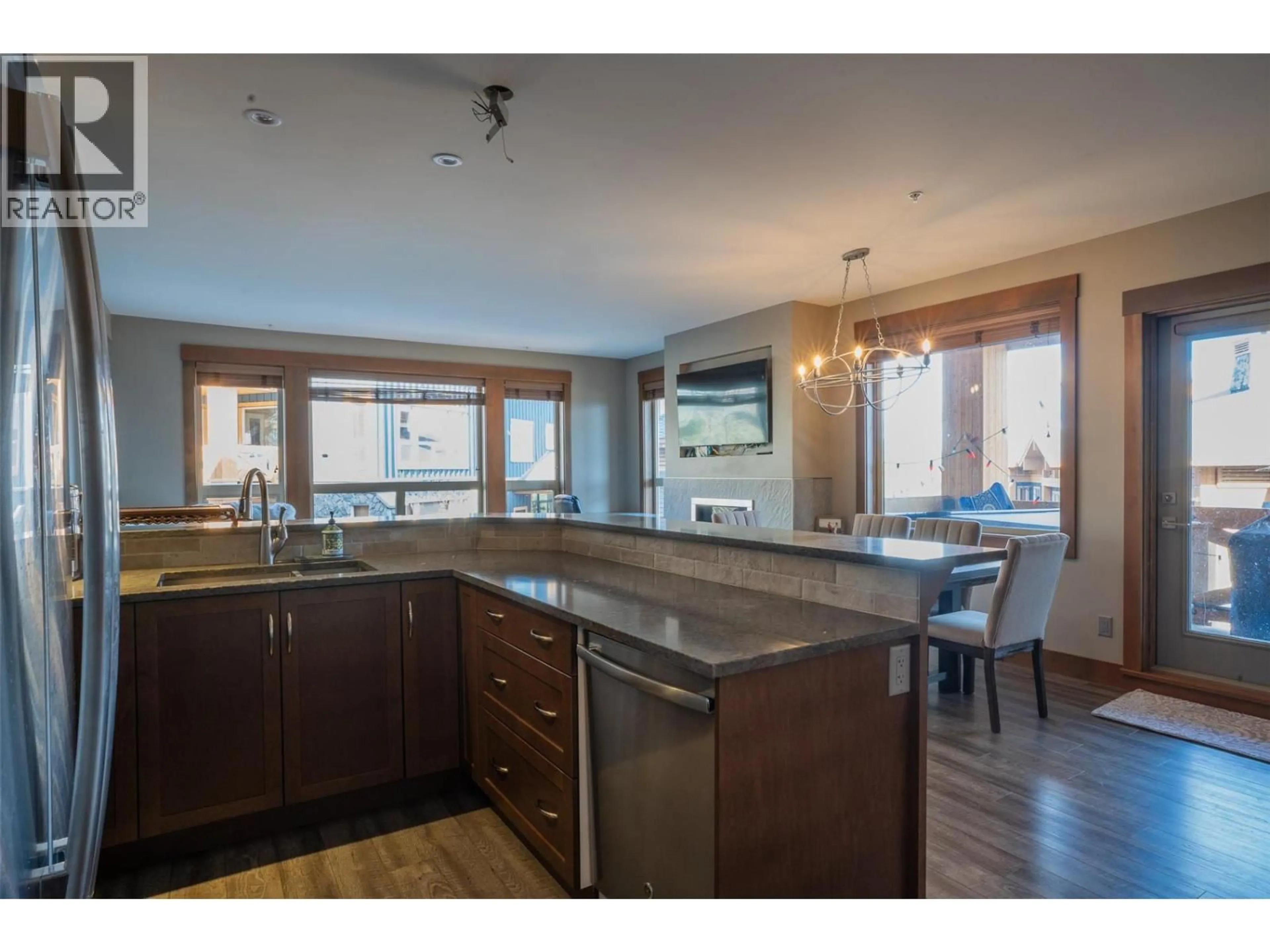 Open concept kitchen, wood/laminate floor for 2208 - 375 RAVEN RIDGE ROAD, Big White British Columbia V1P1T4