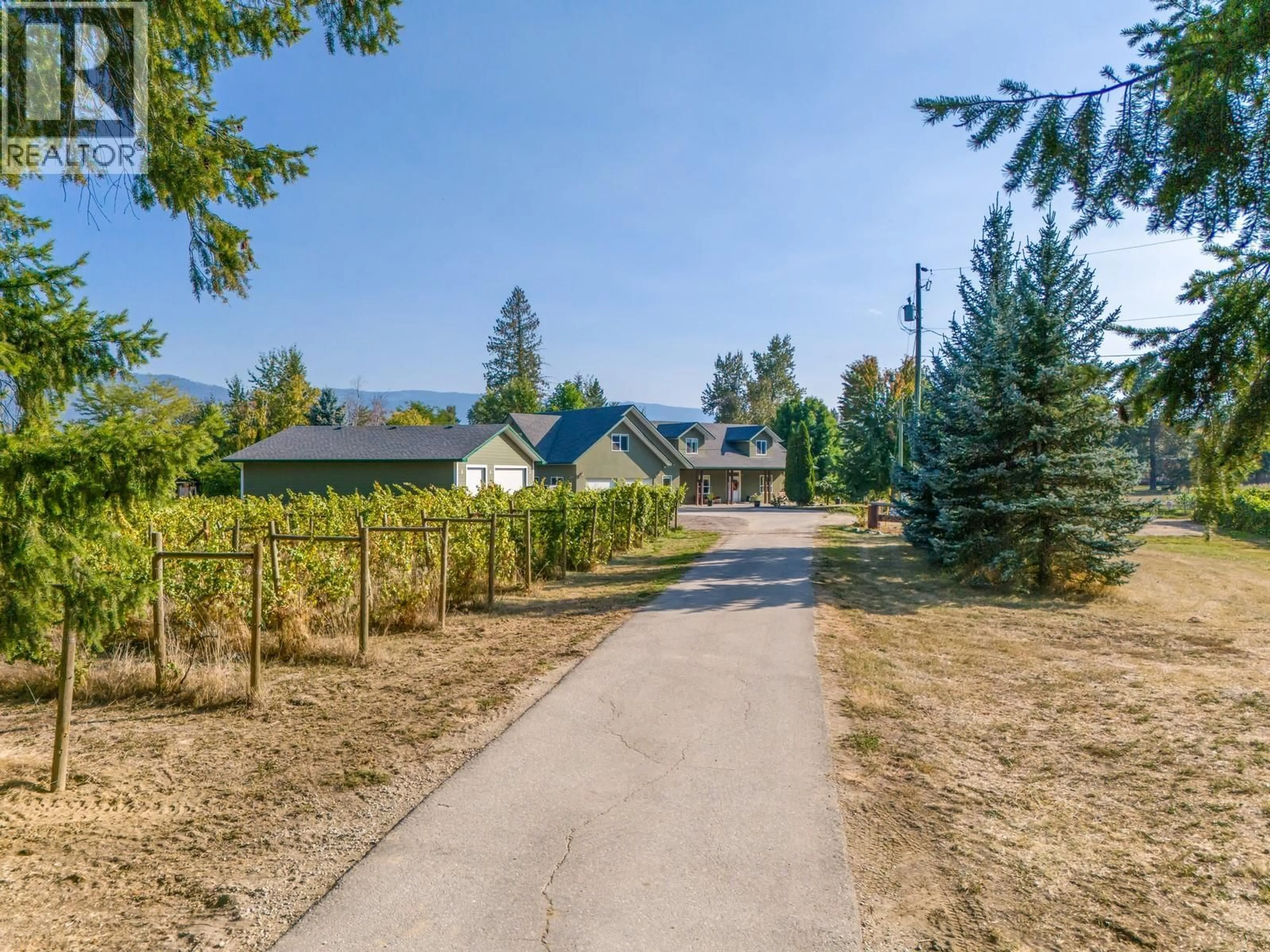 A pic from outside/outdoor area/front of a property/back of a property/a pic from drone, mountain view for 70 WATERSIDE ROAD, Enderby British Columbia V0E1V3