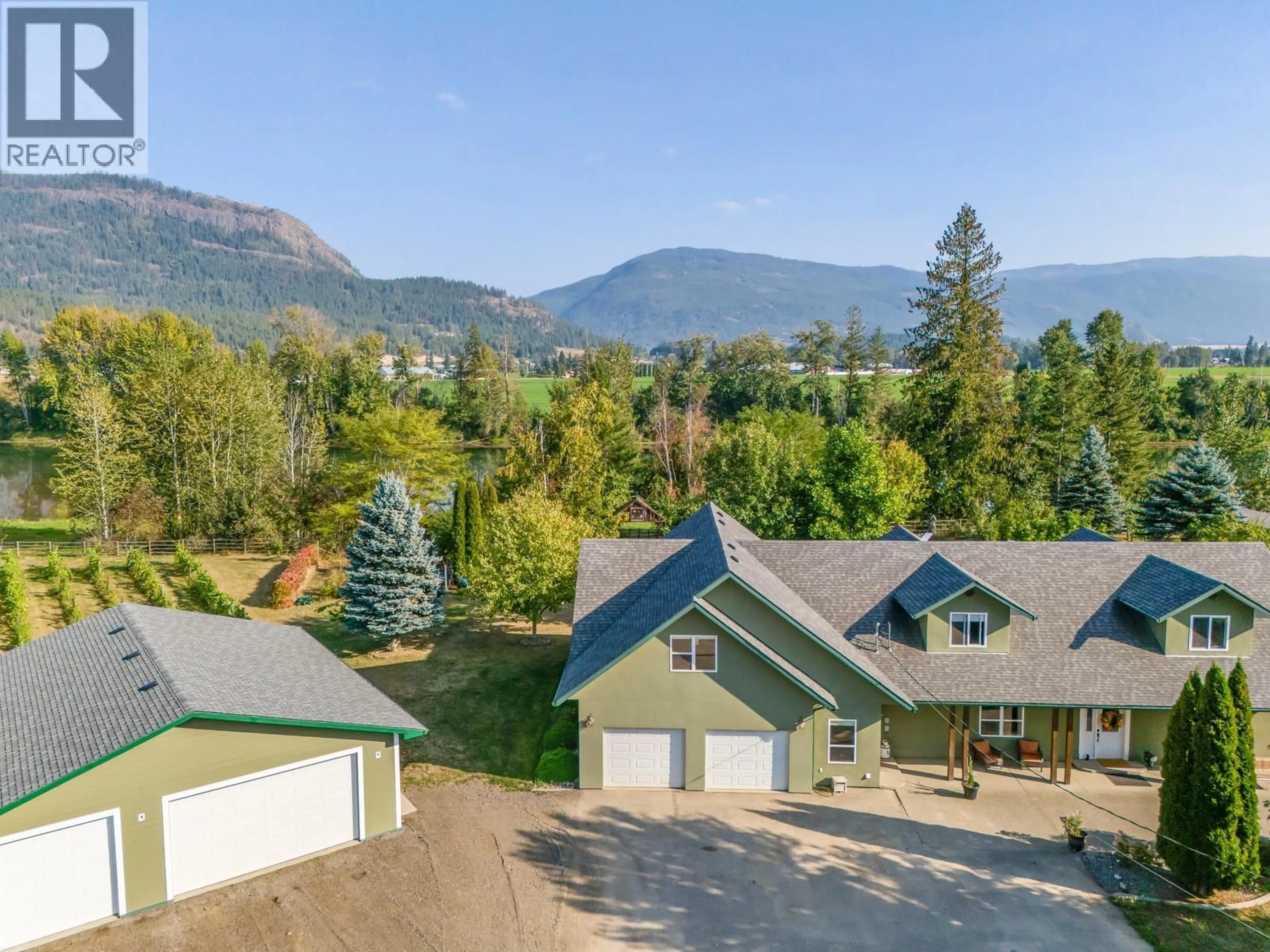 A pic from outside/outdoor area/front of a property/back of a property/a pic from drone, mountain view for 70 WATERSIDE ROAD, Enderby British Columbia V0E1V3