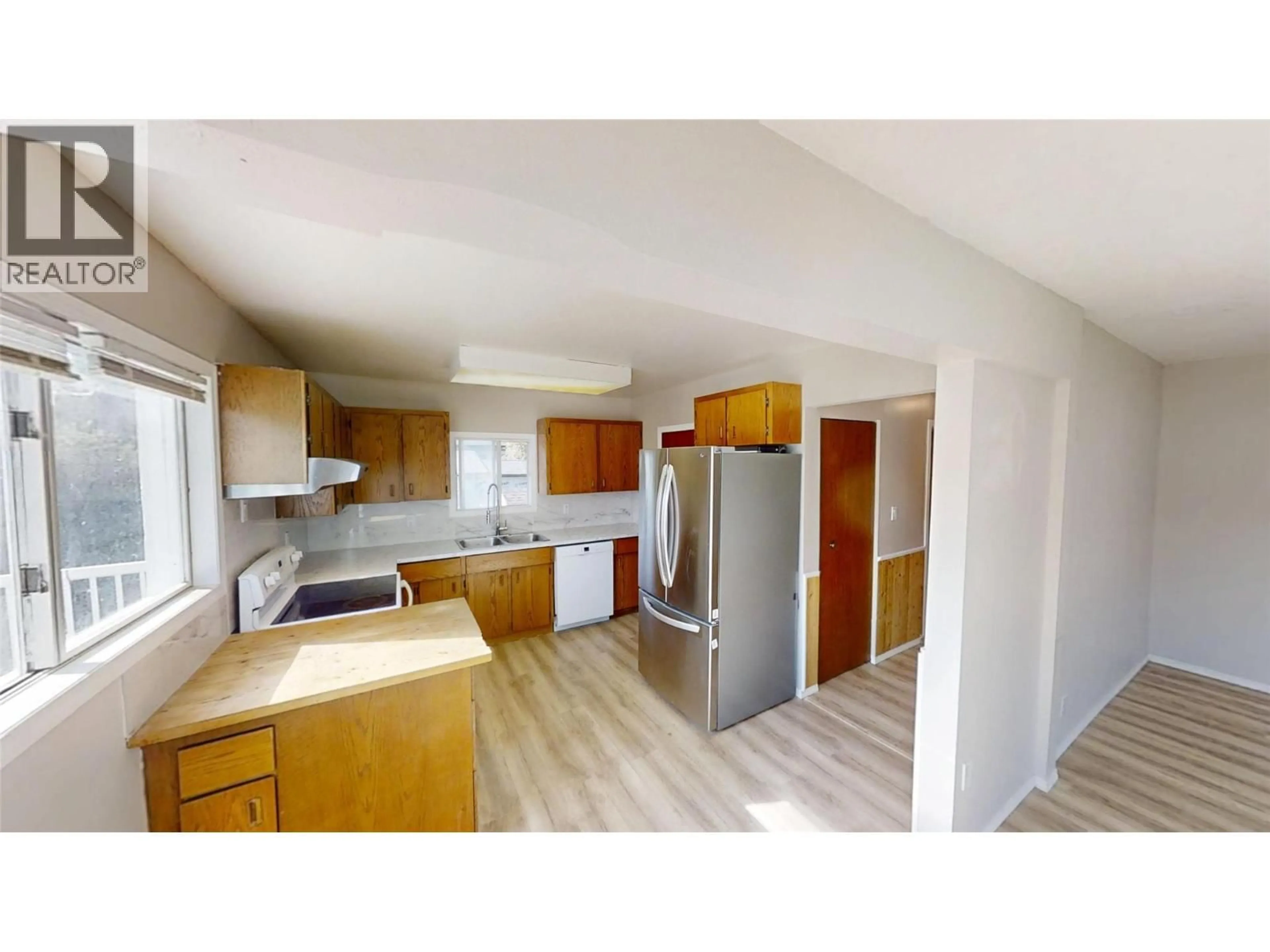 Open concept kitchen, wood/laminate floor for 9179 STARKE AVENUE, Wilmer British Columbia V0A1K5