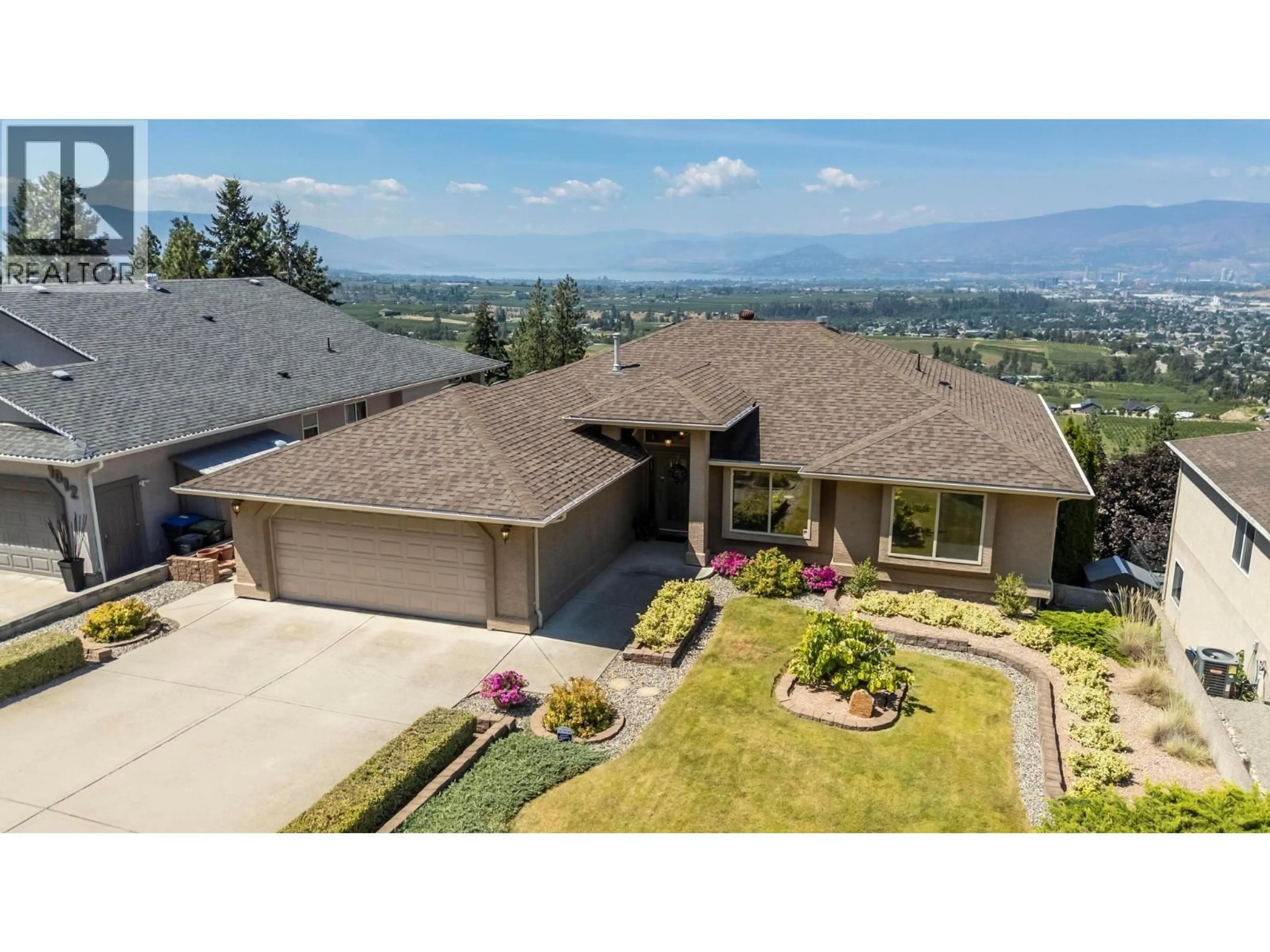 A pic from outside/outdoor area/front of a property/back of a property/a pic from drone, mountain view for 1000 LONE PINE DRIVE, Kelowna British Columbia V1P1M7