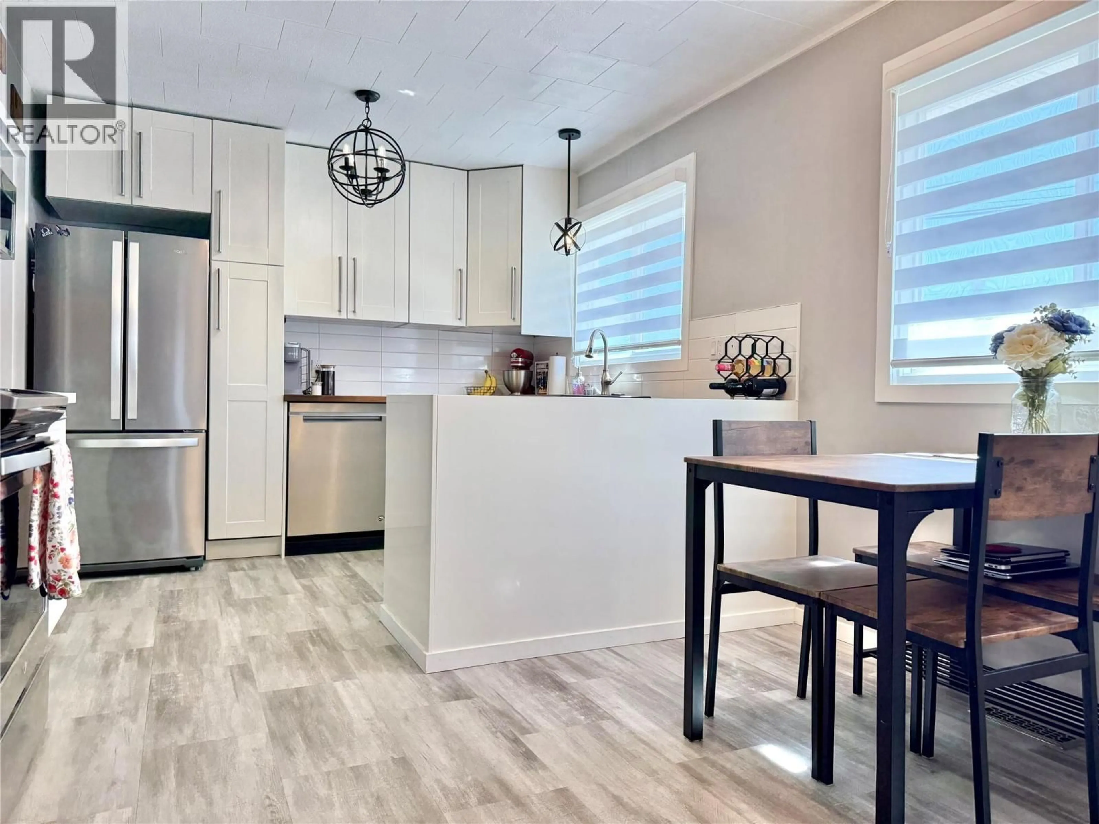 Open concept kitchen, wood/laminate floor for 1971 75 AVENUE, Grand Forks British Columbia V0H1H2