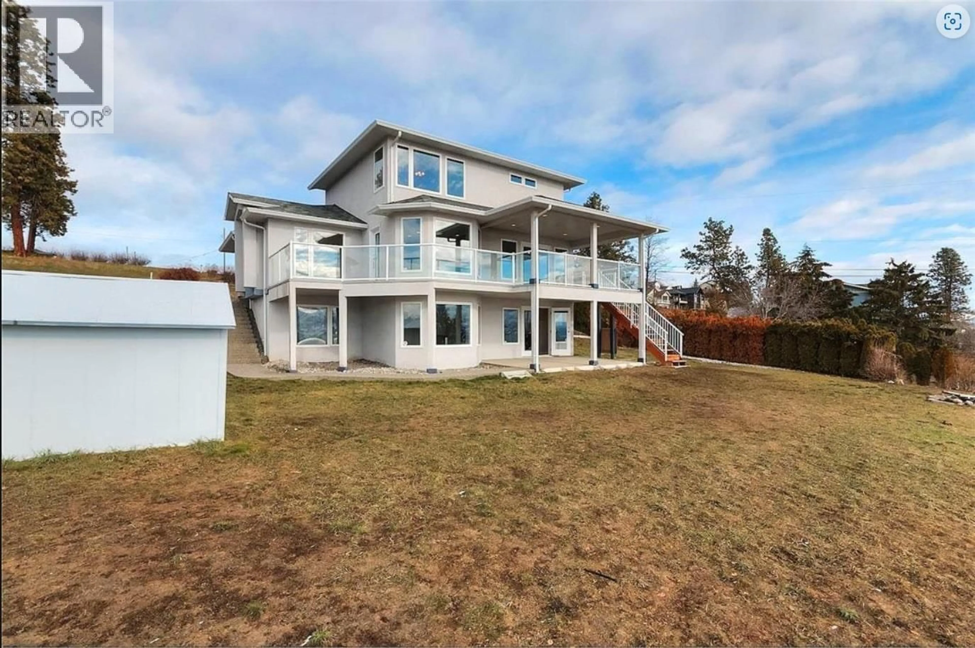A pic from outside/outdoor area/front of a property/back of a property/a pic from drone, water/lake/river/ocean view for 3230 KING ROAD, Kelowna British Columbia V1Z2B5