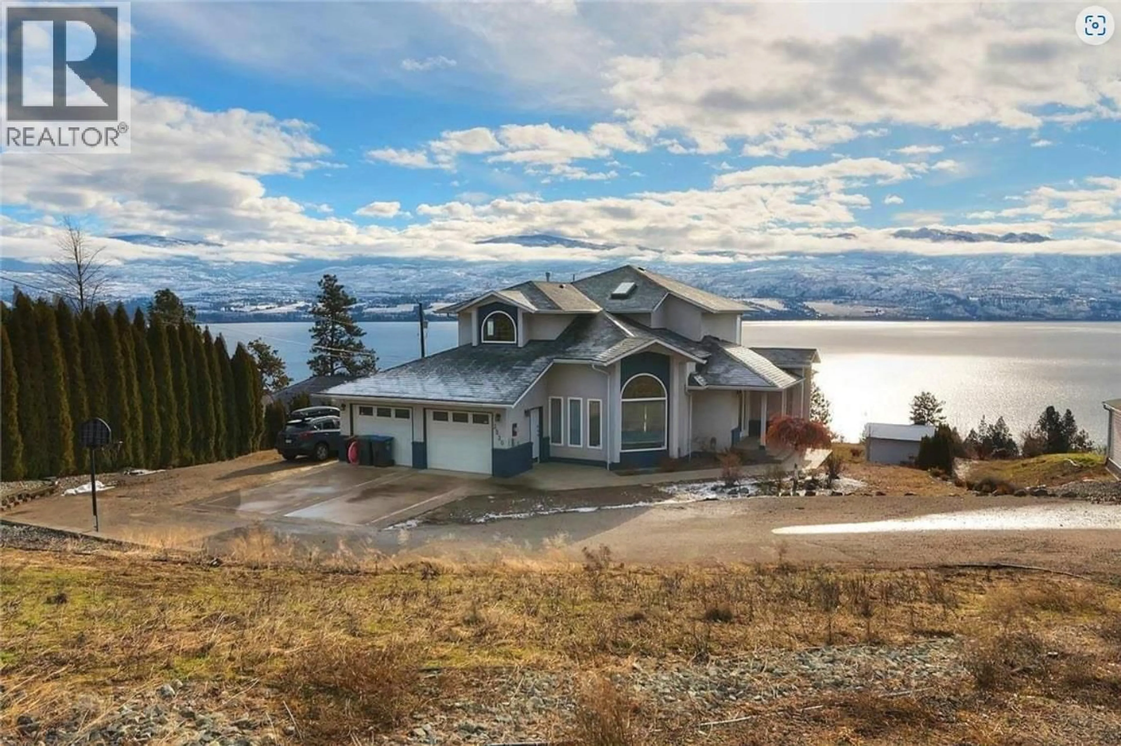 A pic from outside/outdoor area/front of a property/back of a property/a pic from drone, water/lake/river/ocean view for 3230 KING ROAD, Kelowna British Columbia V1Z2B5
