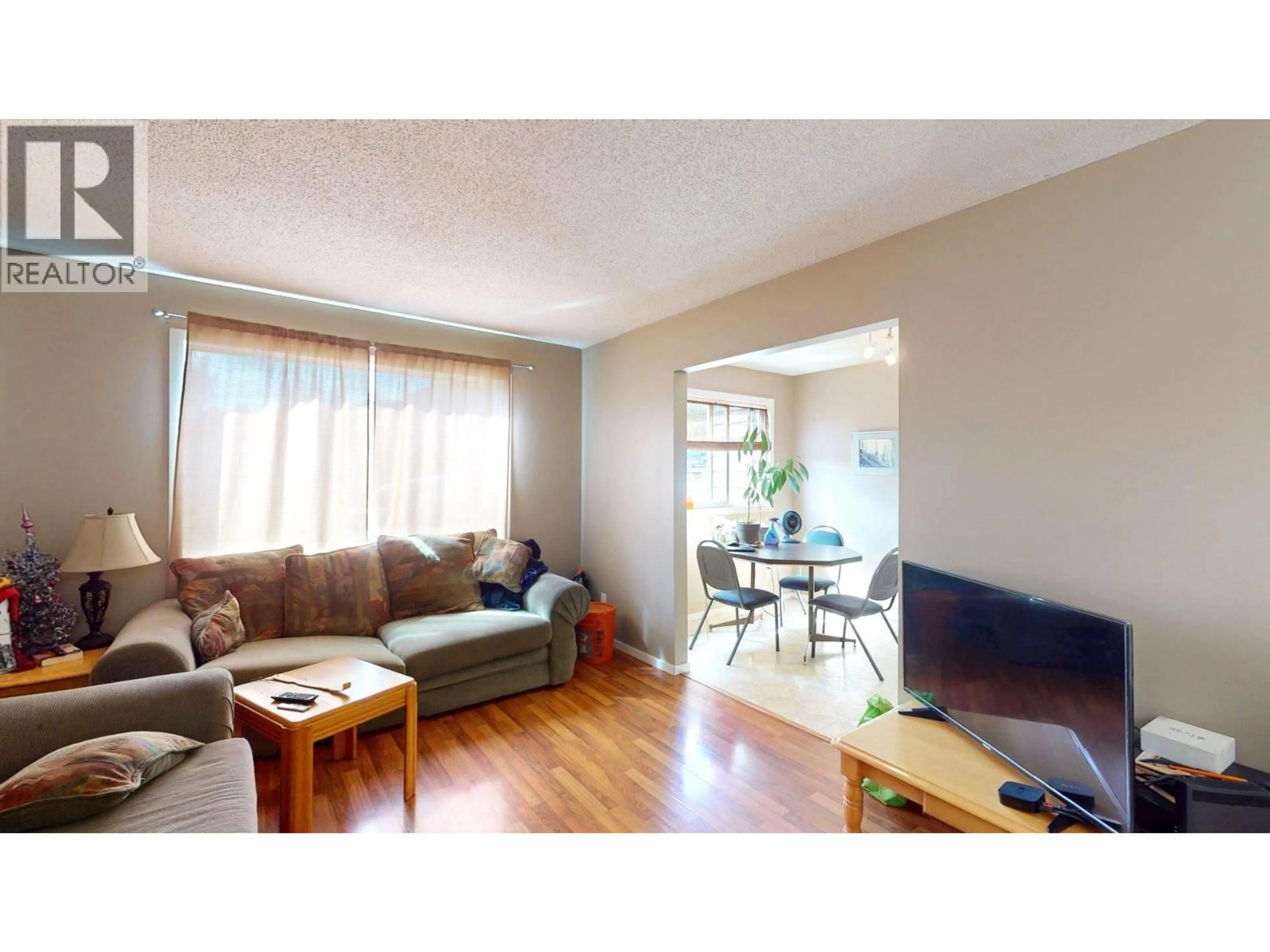 Living room with furniture, wood/laminate floor for 2037 ALDER STREET, Elkford British Columbia V0B1H0