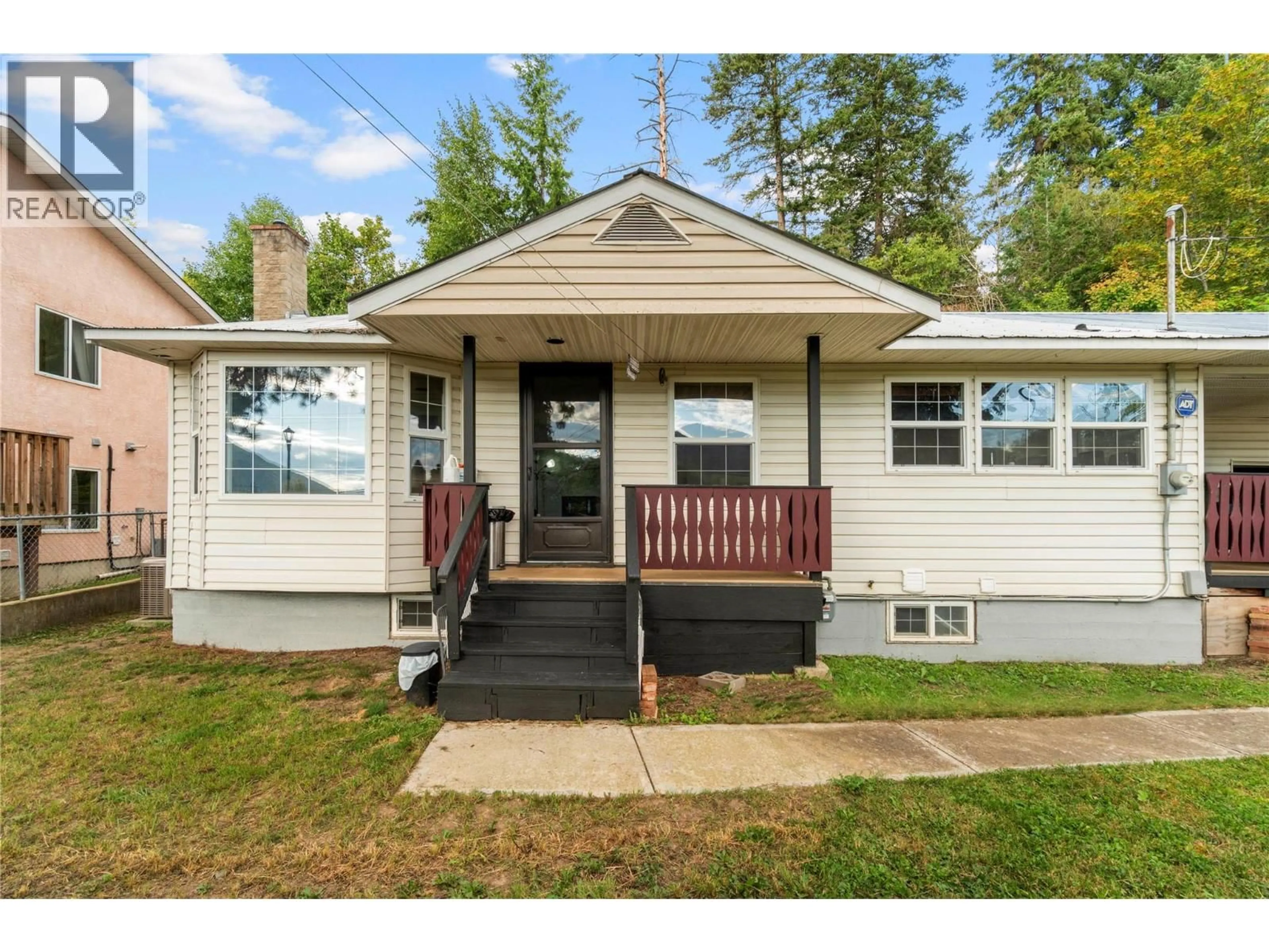 Home with vinyl exterior material, street for 124 SALMON ARM DRIVE, Enderby British Columbia V0E1V1
