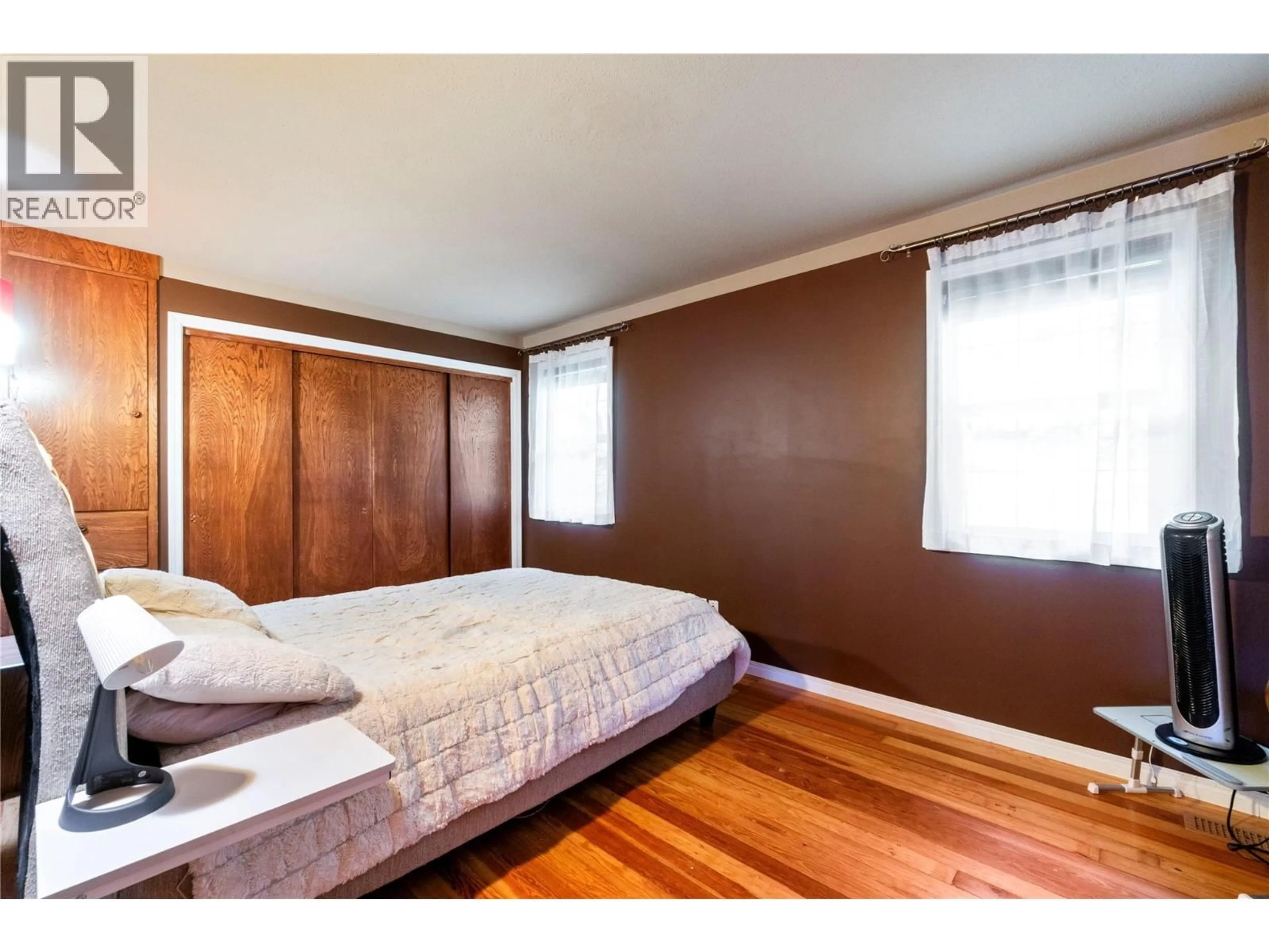 Bedroom with bed, wood/laminate floor for 124 SALMON ARM DRIVE, Enderby British Columbia V0E1V1