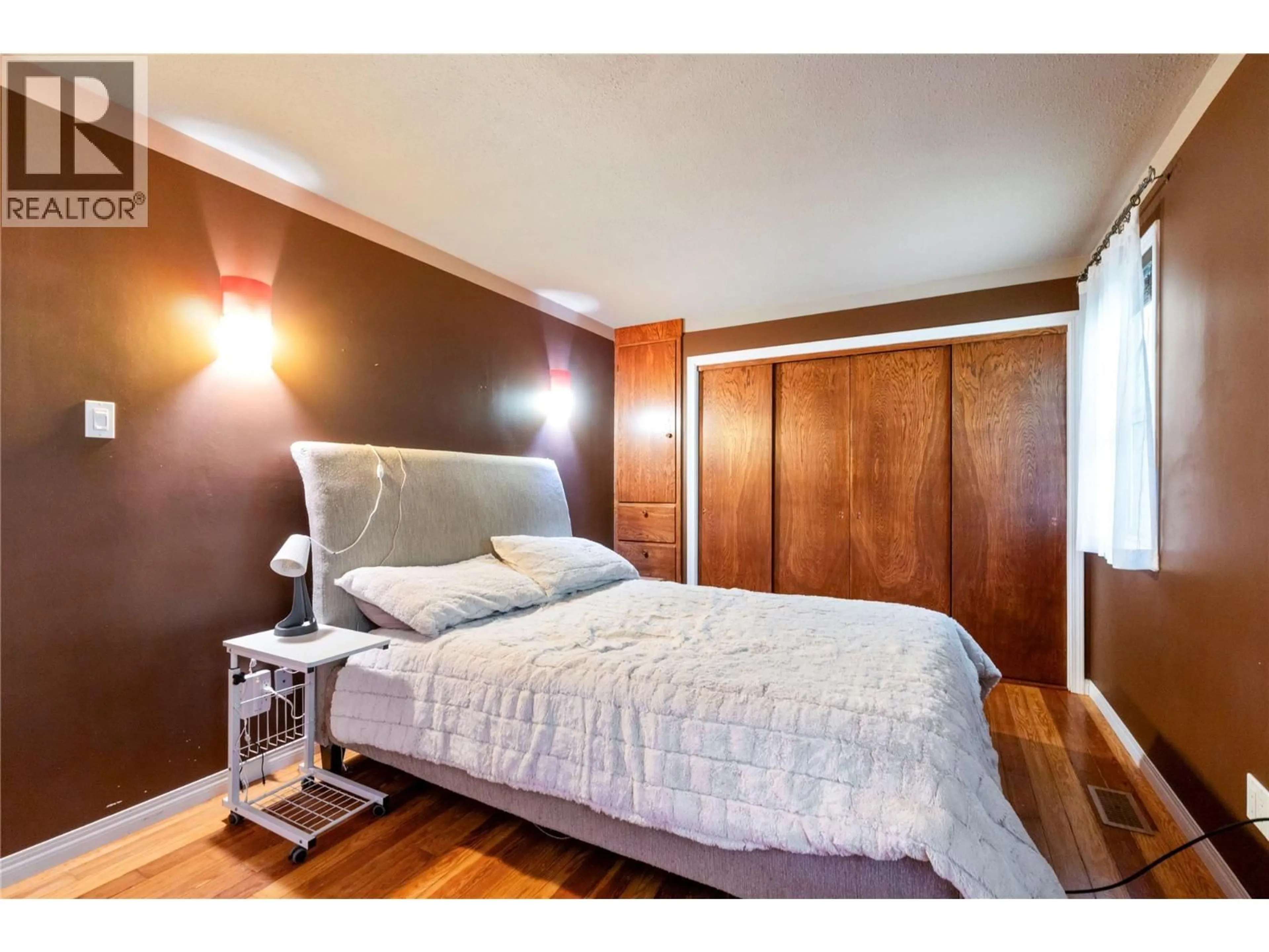 Bedroom with bed, wood/laminate floor for 124 SALMON ARM DRIVE, Enderby British Columbia V0E1V1