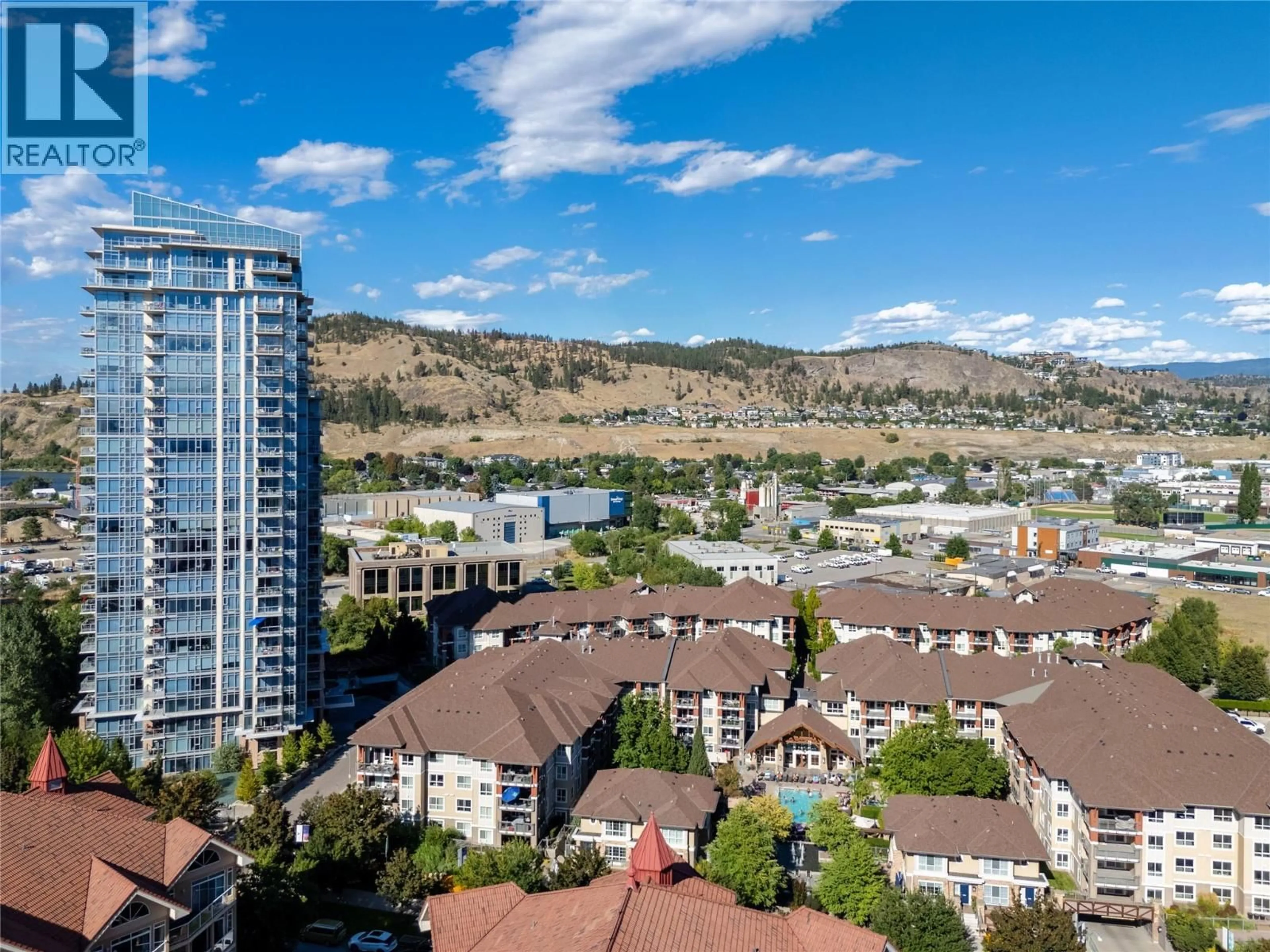 A pic from outside/outdoor area/front of a property/back of a property/a pic from drone, mountain view for 1904 - 1075 SUNSET DRIVE, Kelowna British Columbia V1Y9Y9
