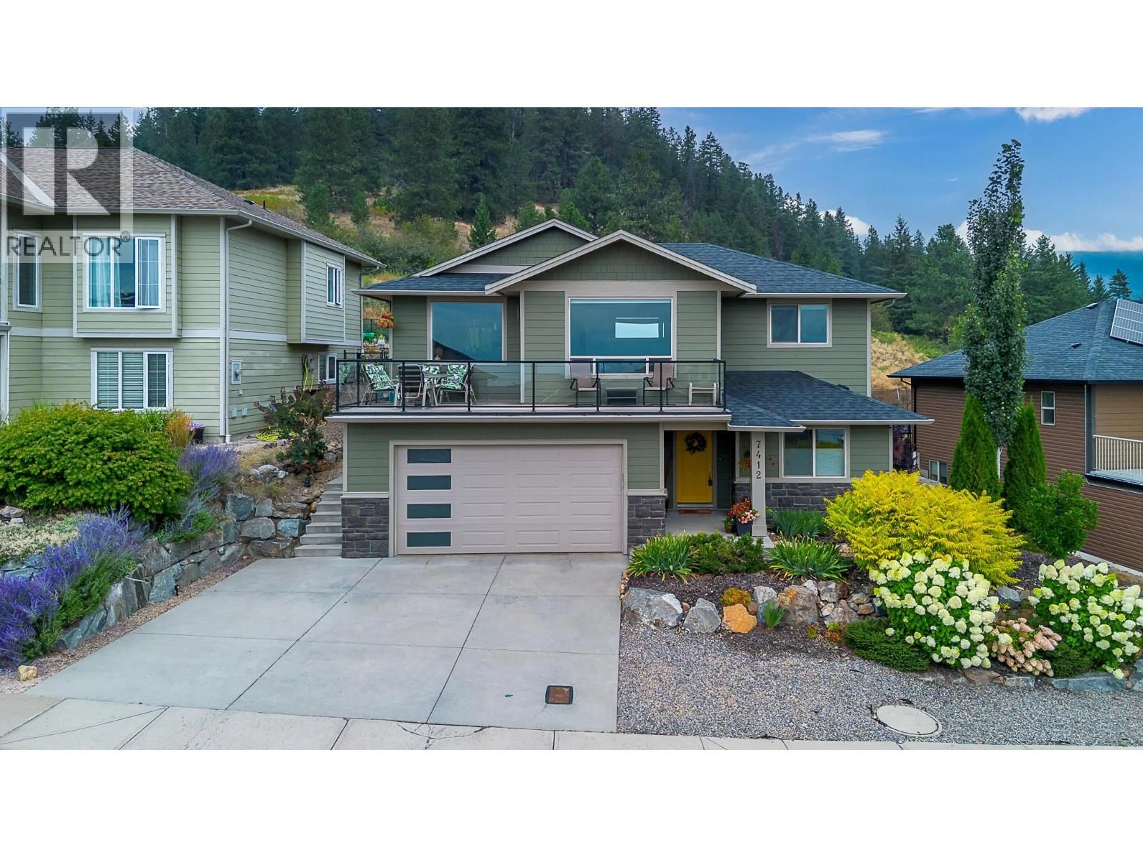 A pic from outside/outdoor area/front of a property/back of a property/a pic from drone, street for 7412 SUN PEAKS DRIVE, Vernon British Columbia V1B4C6