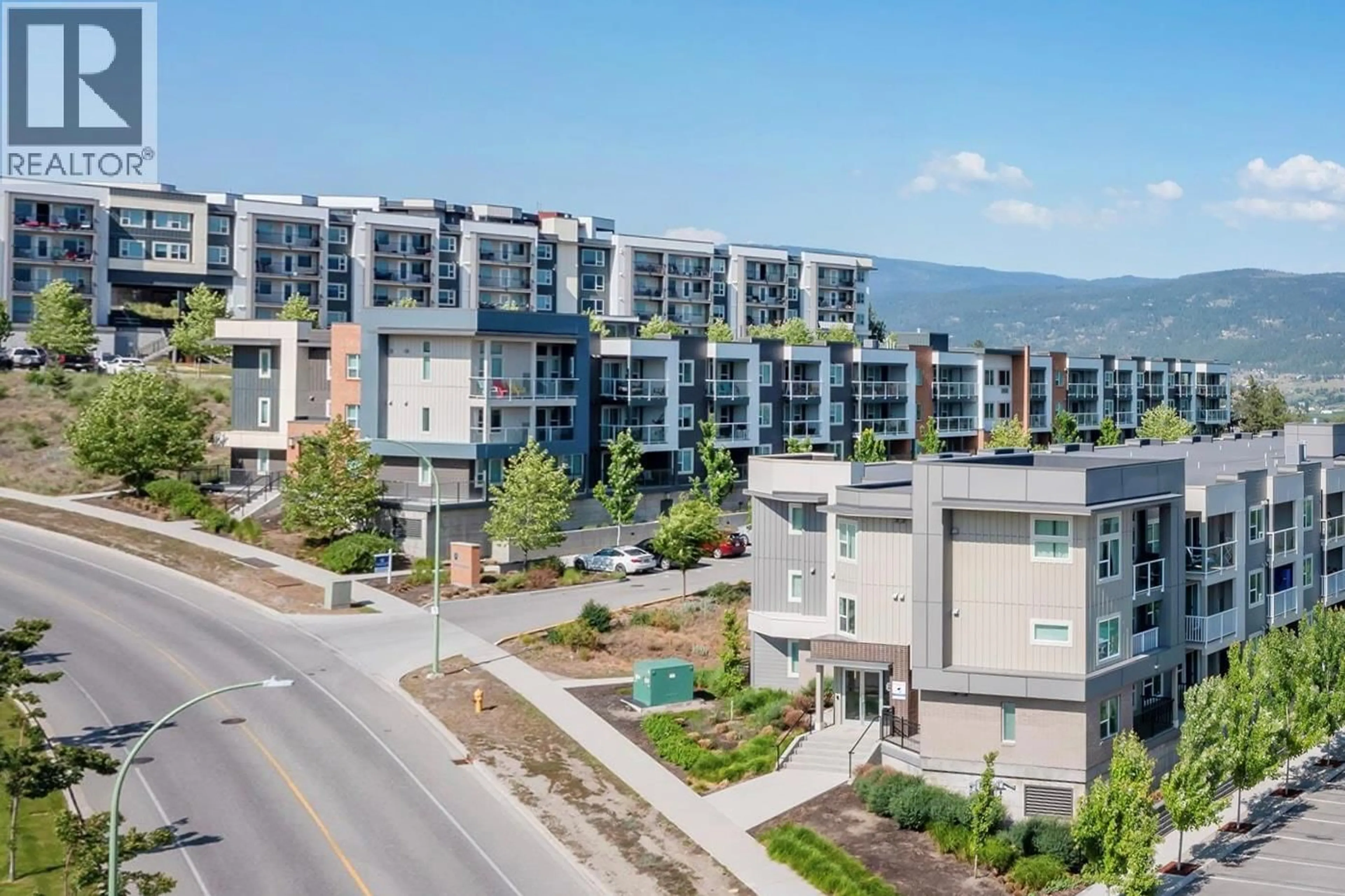 A pic from outside/outdoor area/front of a property/back of a property/a pic from drone, mountain view for PH17 - 775 ACADEMY WAY, Kelowna British Columbia V1V0A5