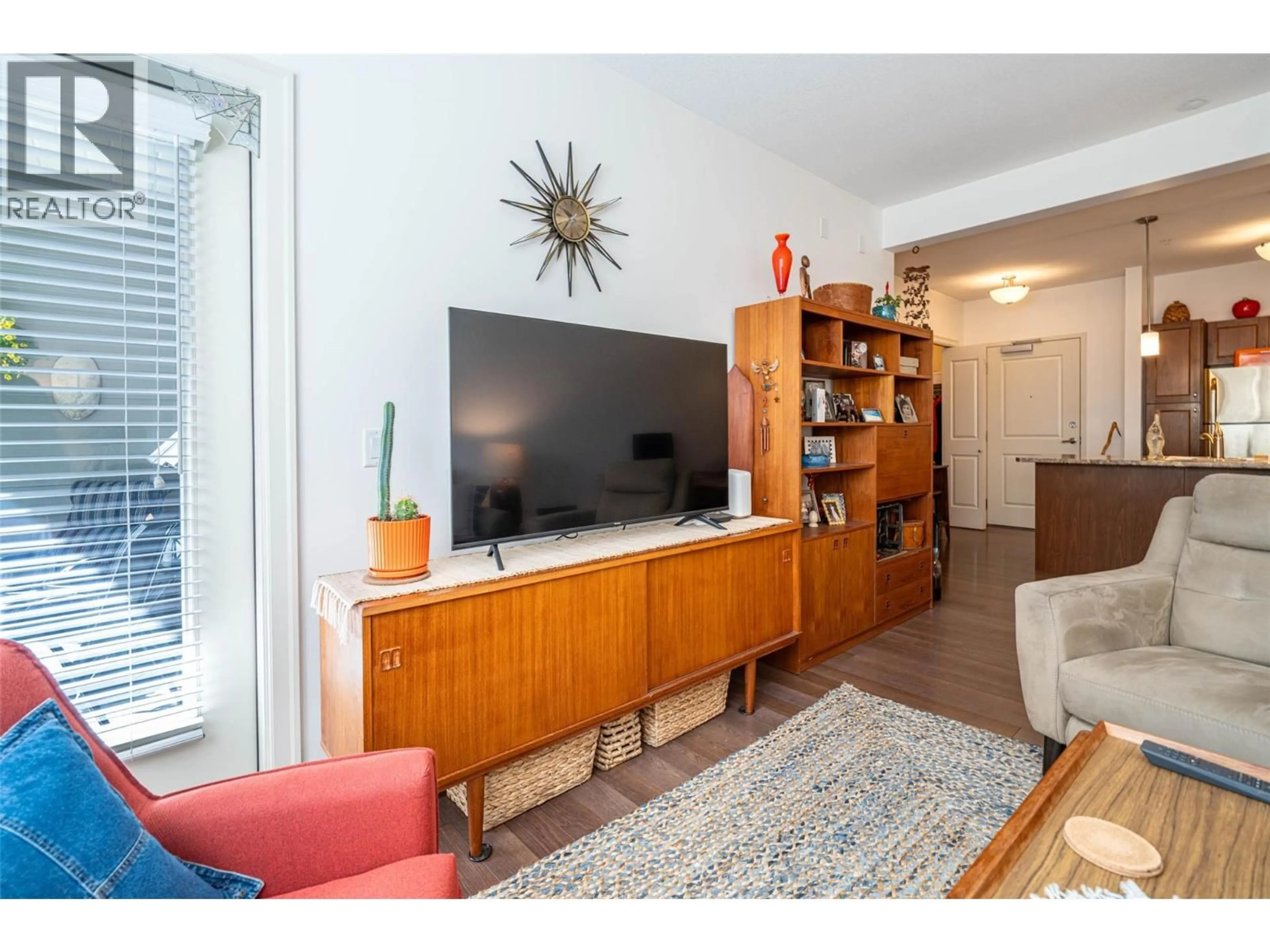 Living room with furniture, wood/laminate floor for 205 - 3010 35 STREET, Vernon British Columbia V1T0A7