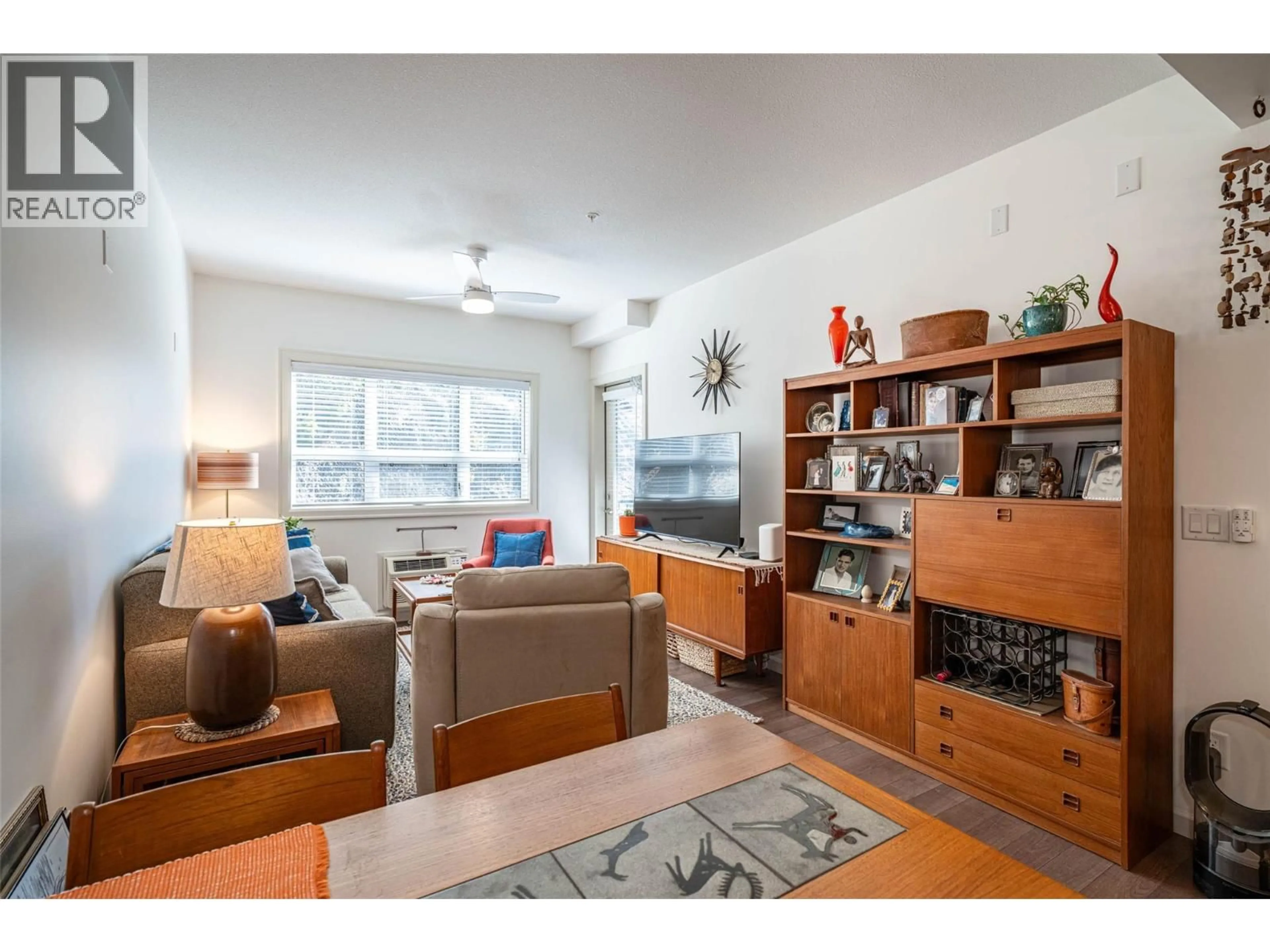 Living room with furniture, wood/laminate floor for 205 - 3010 35 STREET, Vernon British Columbia V1T0A7