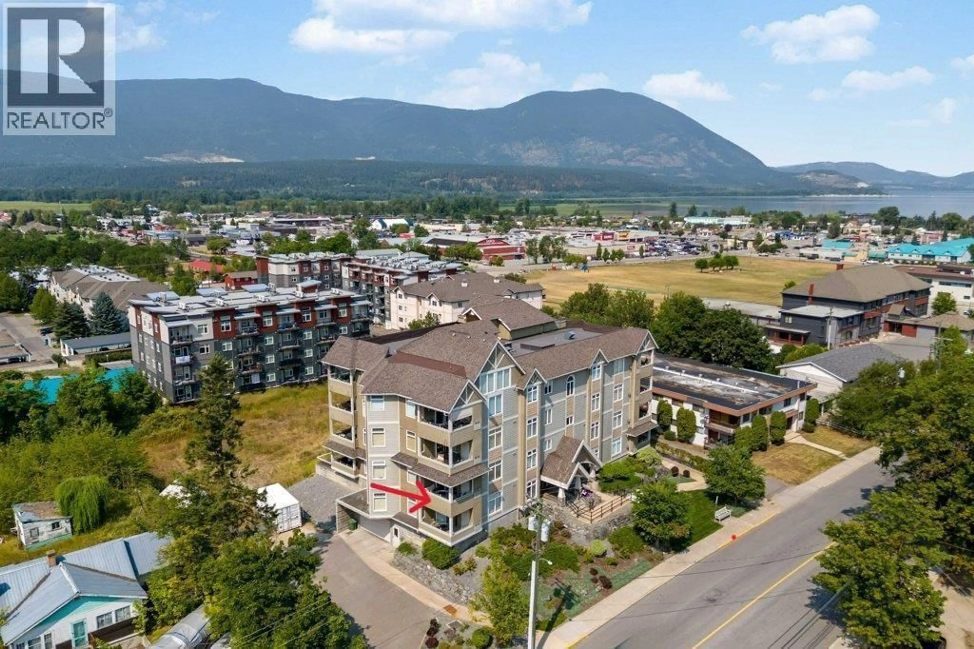 A pic from outside/outdoor area/front of a property/back of a property/a pic from drone, mountain view for 203 - 611 SHUSWAP STREET SOUTHWEST, Salmon Arm British Columbia V1E0A2