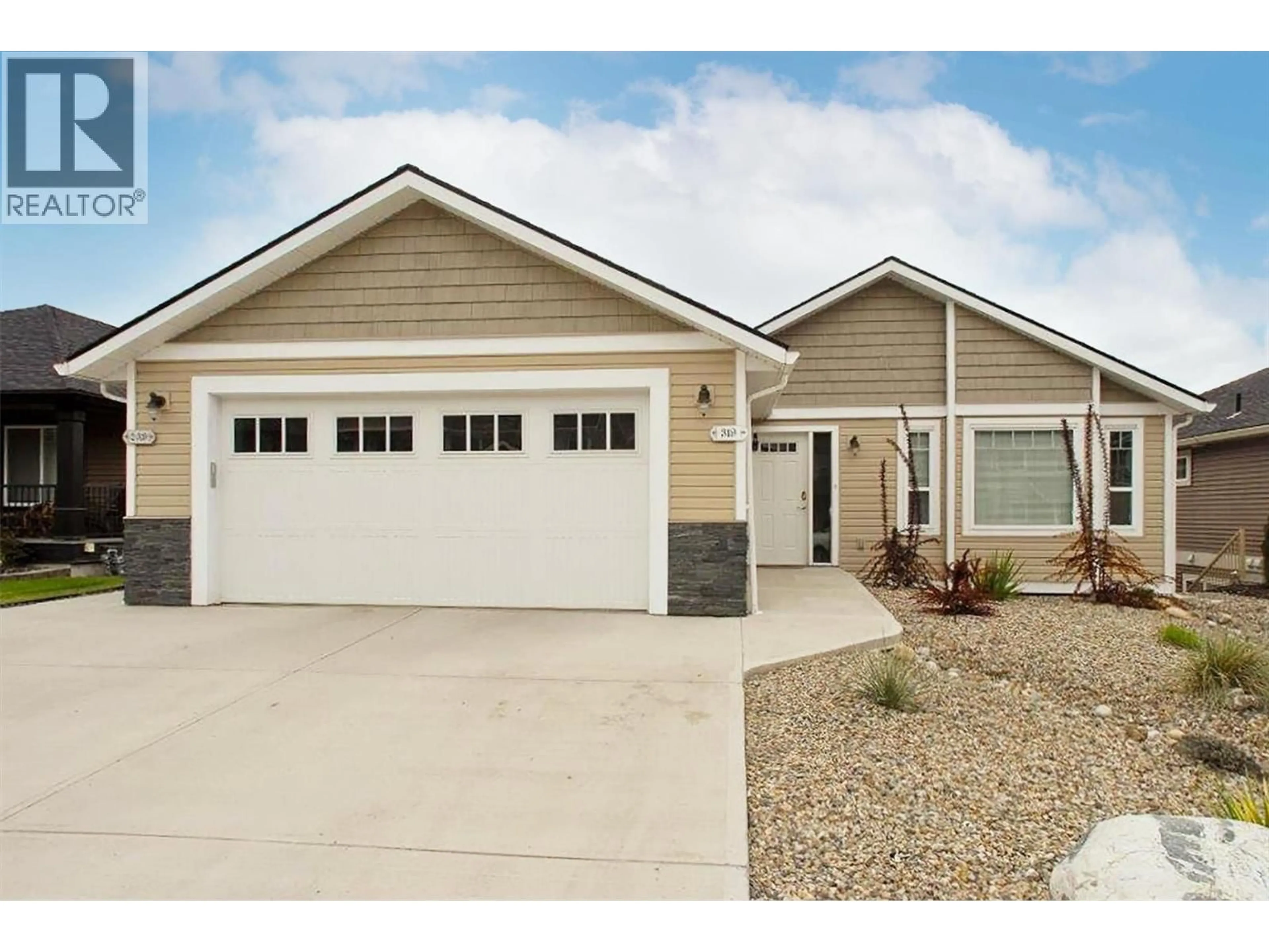 Home with vinyl exterior material, street for 319 ARAB ROAD, Kelowna British Columbia V1V3A8