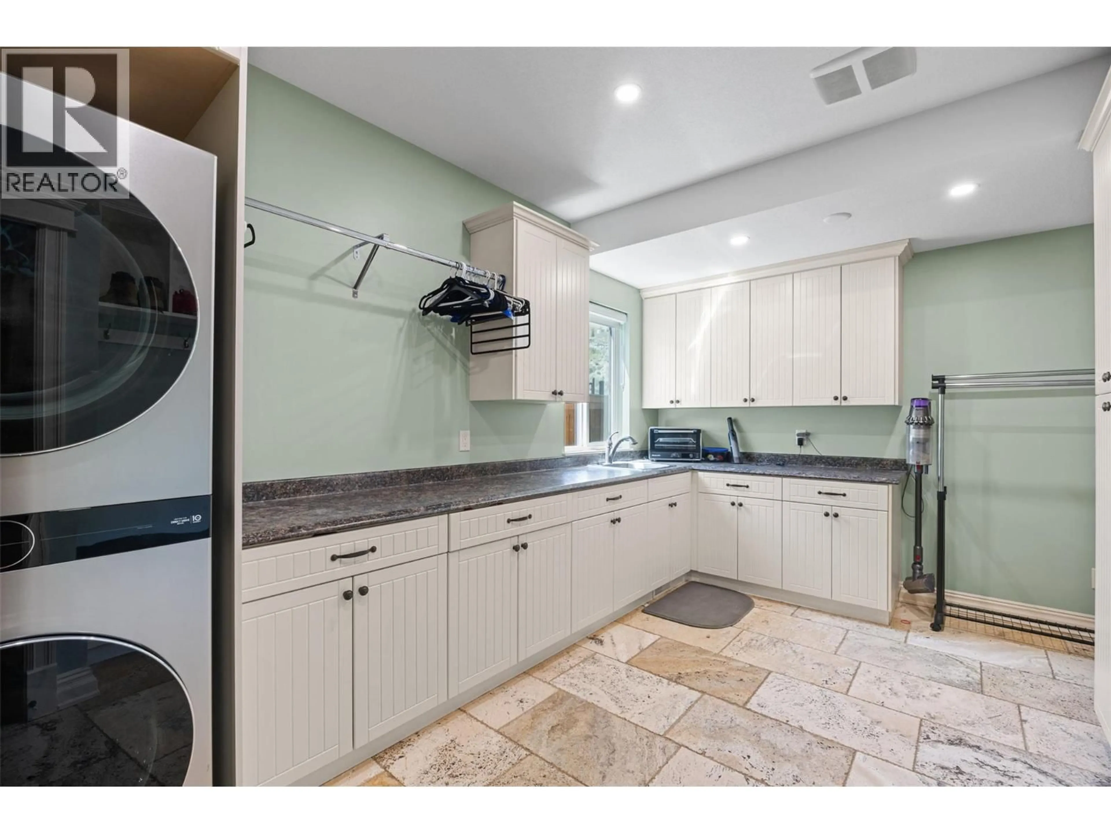 Kitchen with laundary machines, ceramic/tile floor for 3013 VISAO COURT, Kamloops British Columbia V2H0C6