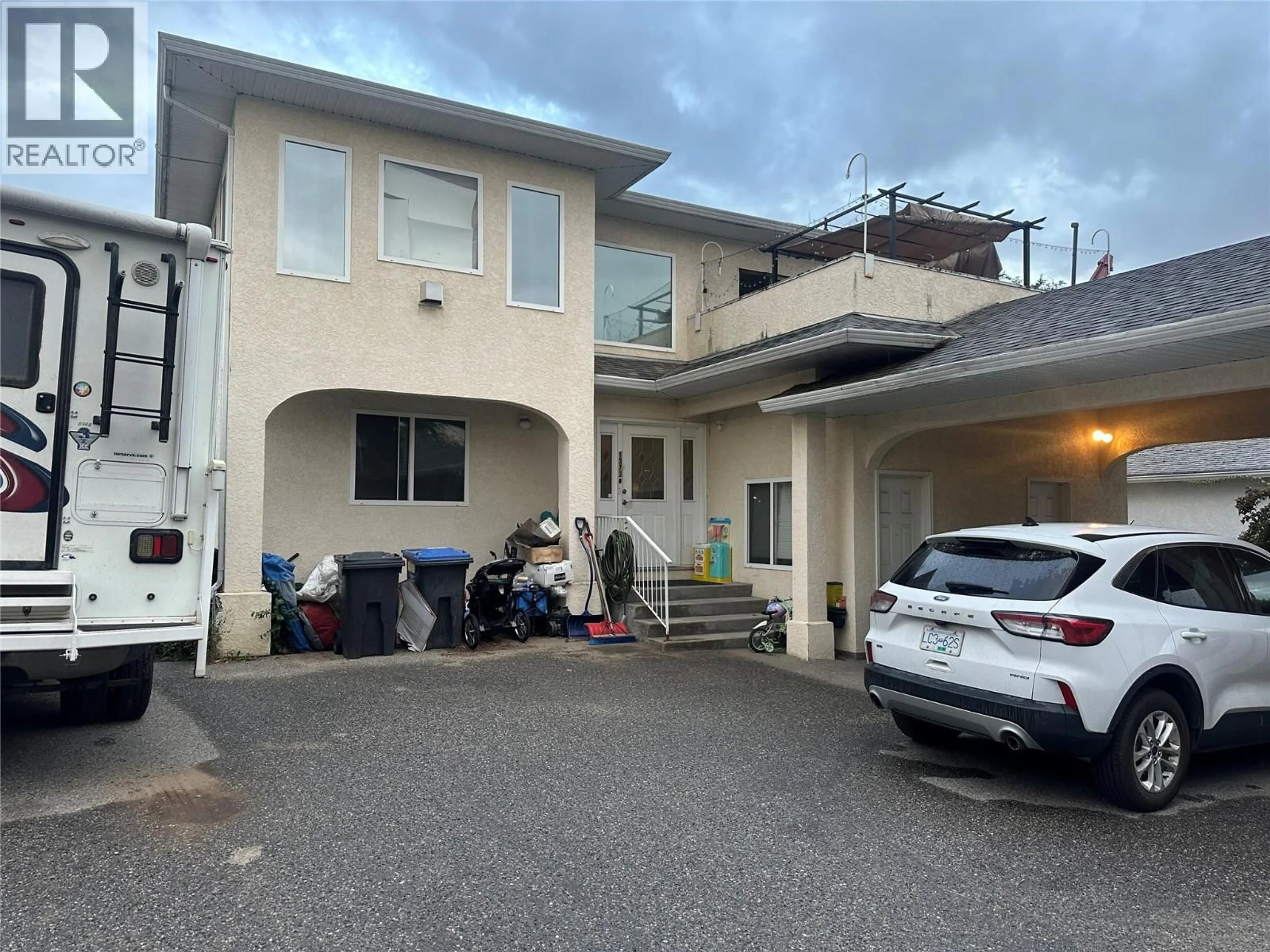 A pic from outside/outdoor area/front of a property/back of a property/a pic from drone, street for 1373 ORCHARD DRIVE, Kelowna British Columbia V1Y3V1