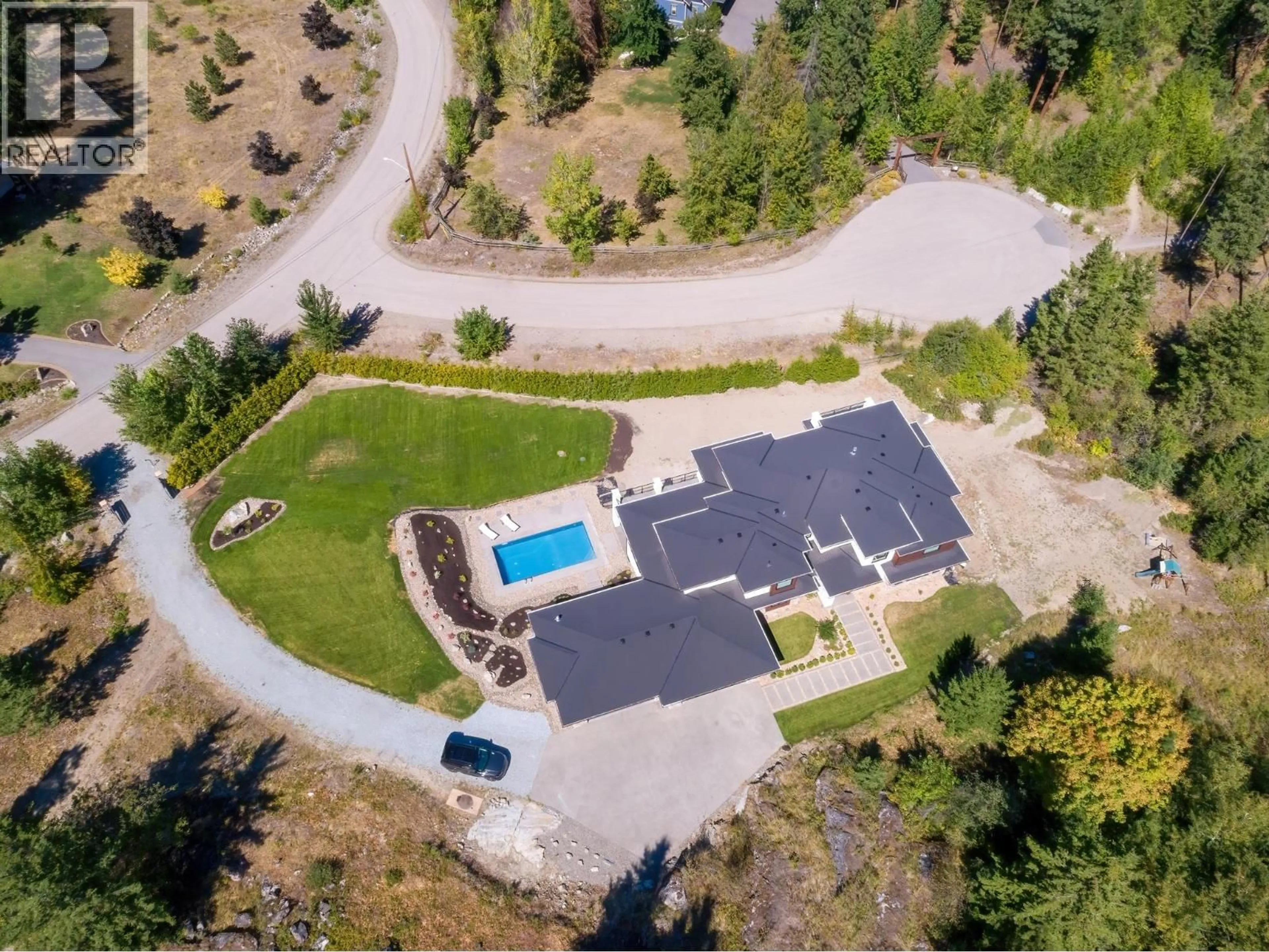 A pic from outside/outdoor area/front of a property/back of a property/a pic from drone, mountain view for 4451 HAYES ROAD, Kelowna British Columbia V1W5A7