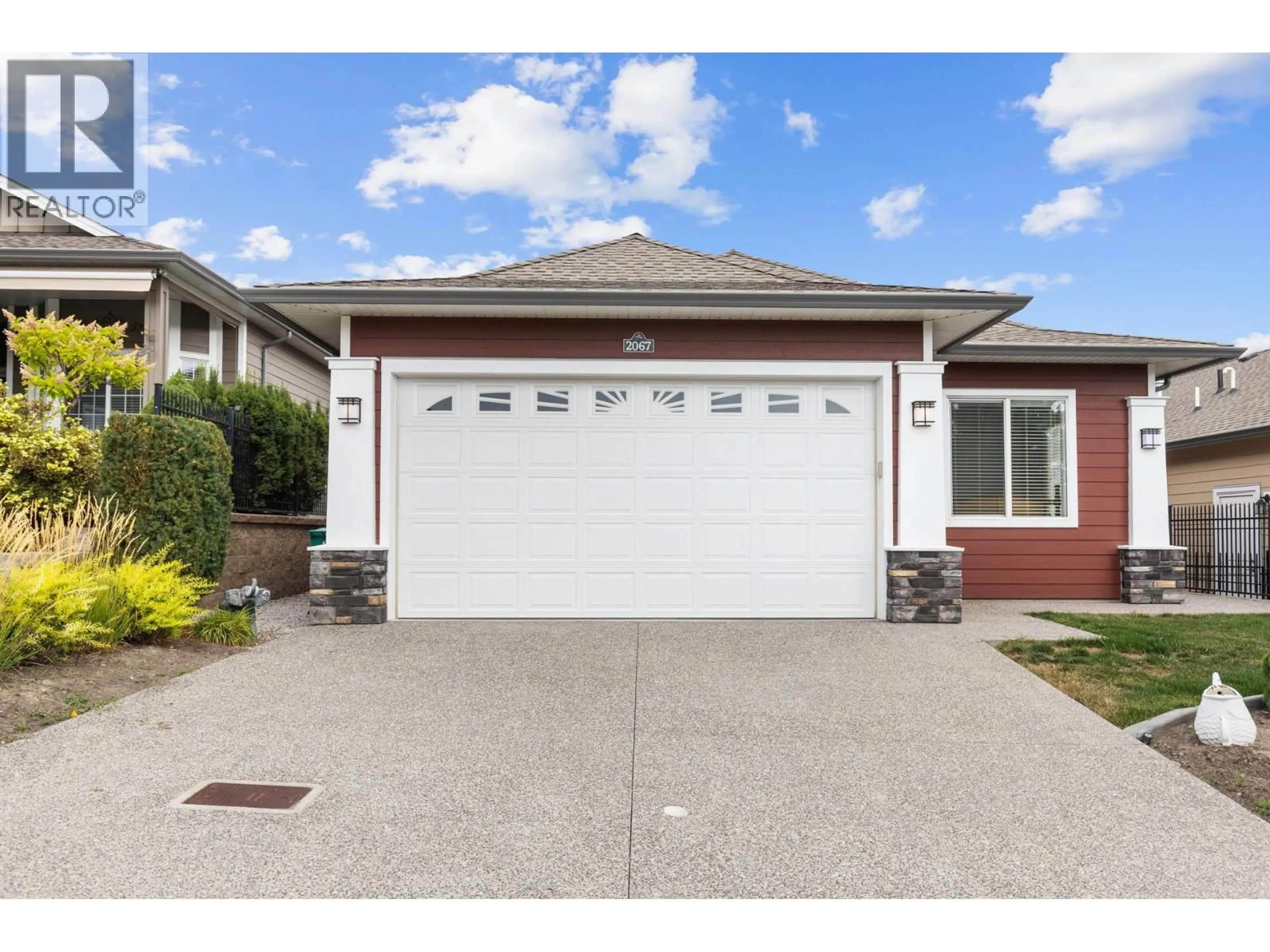 Home with vinyl exterior material, street for 2067 MALLARD DRIVE, Westbank British Columbia V4T3A5