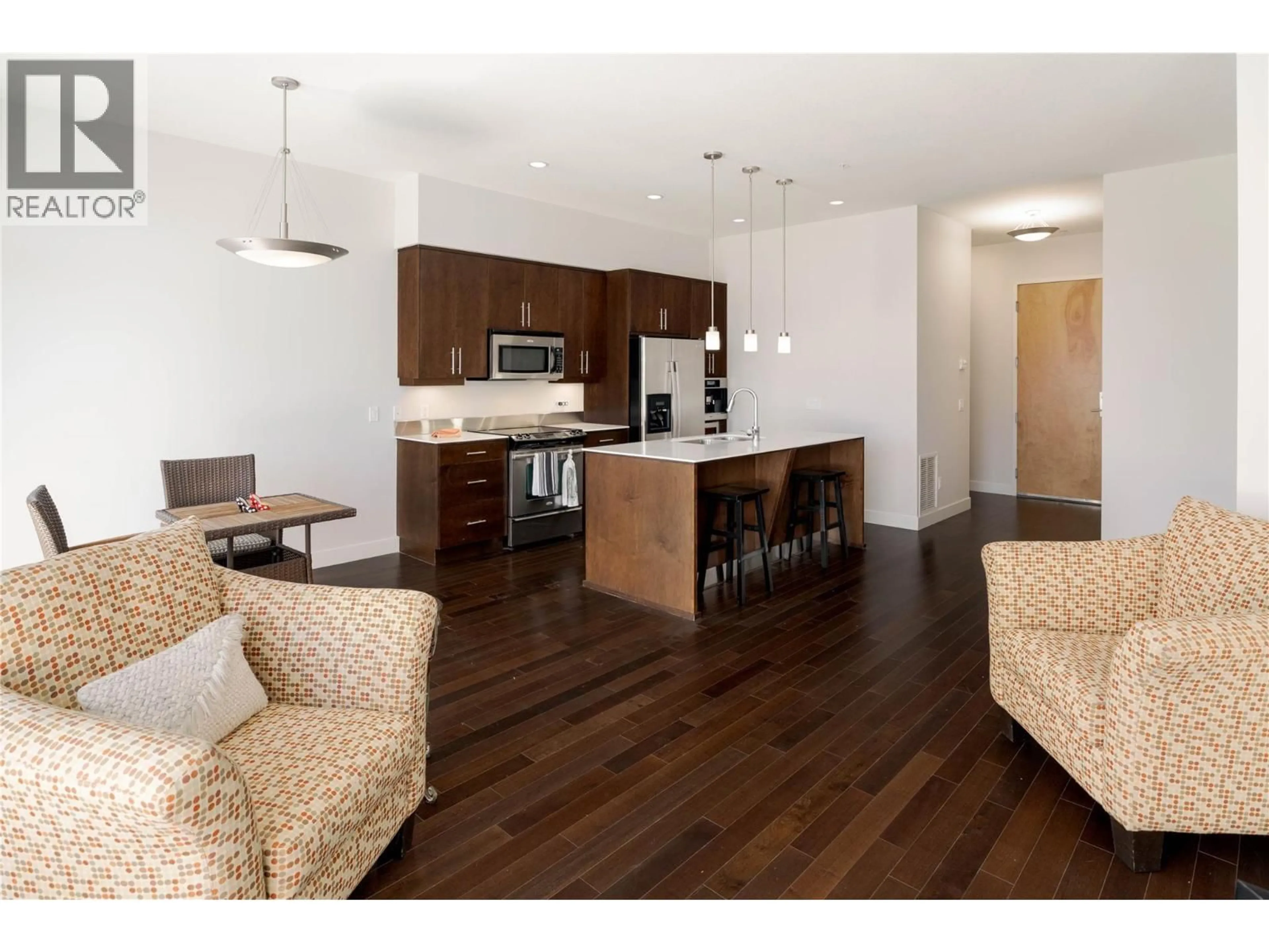 Open concept kitchen, wood/laminate floor for 304 - 1495 GRAHAM STREET, Kelowna British Columbia V1Y3B2