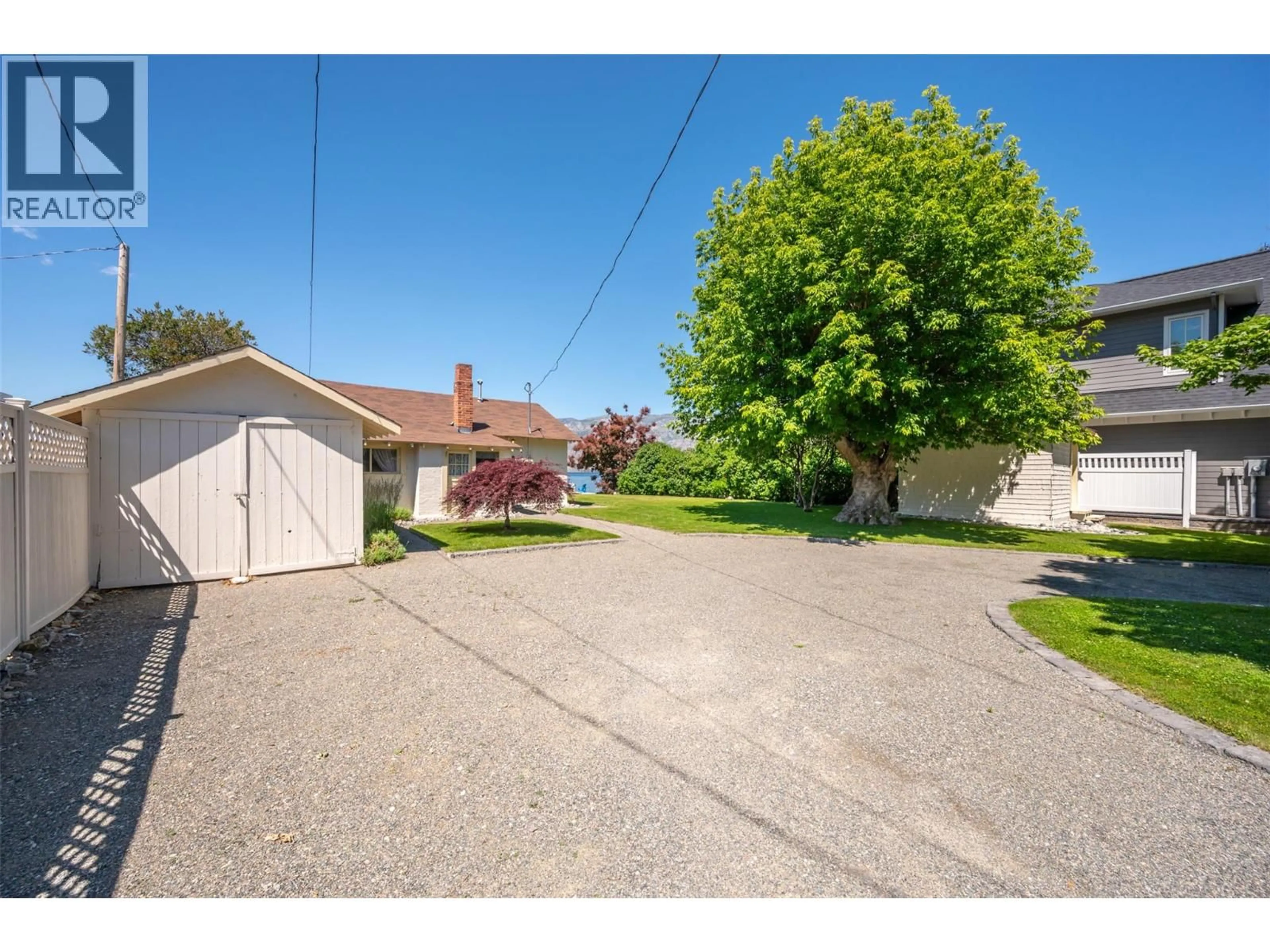 A pic from outside/outdoor area/front of a property/back of a property/a pic from drone, street for 19235 LAKESHORE DRIVE NORTH, Summerland British Columbia V0H1Z6