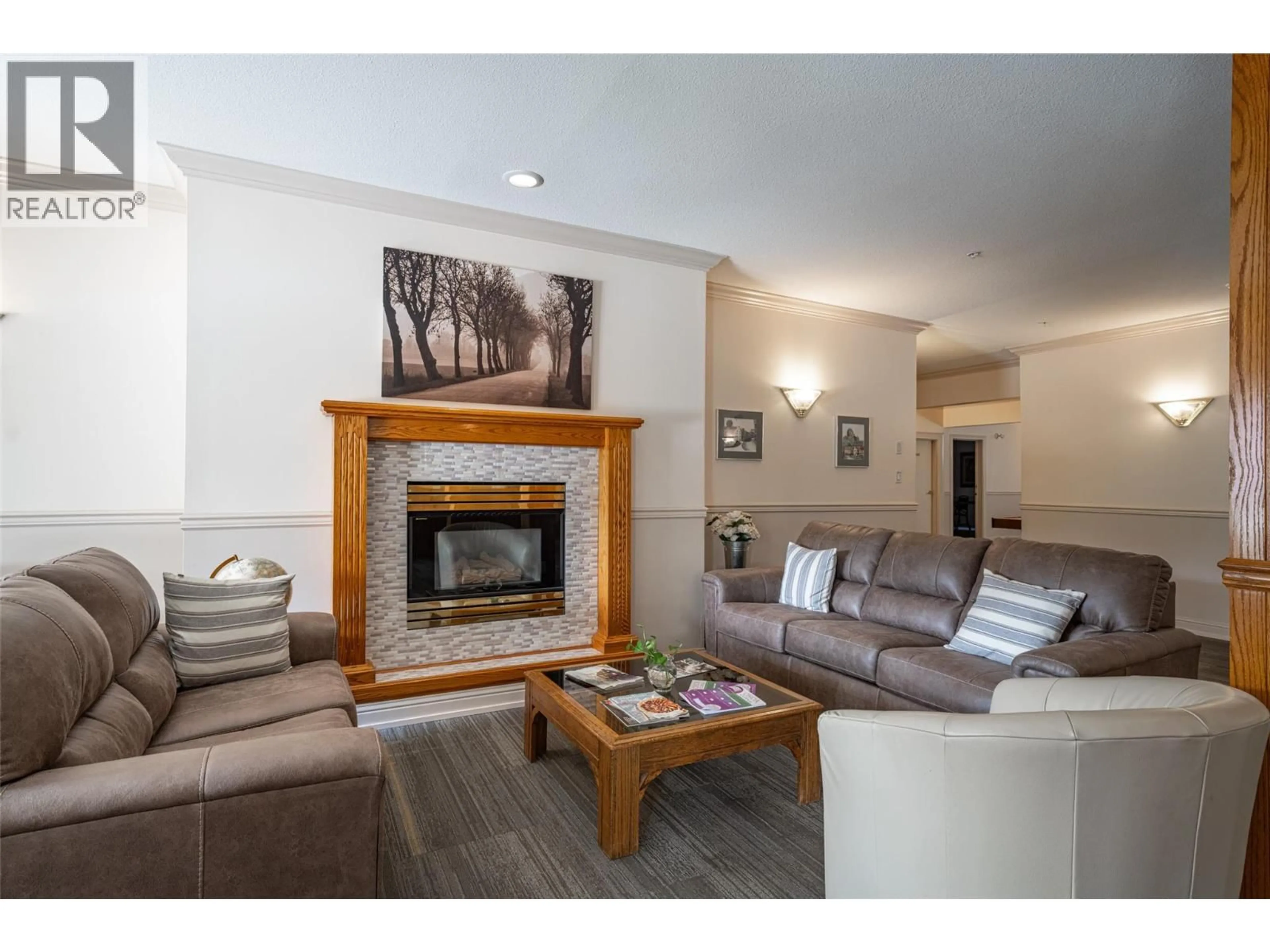 Living room with furniture, wood/laminate floor for 112 - 3805 30 AVENUE, Vernon British Columbia V1T9M3