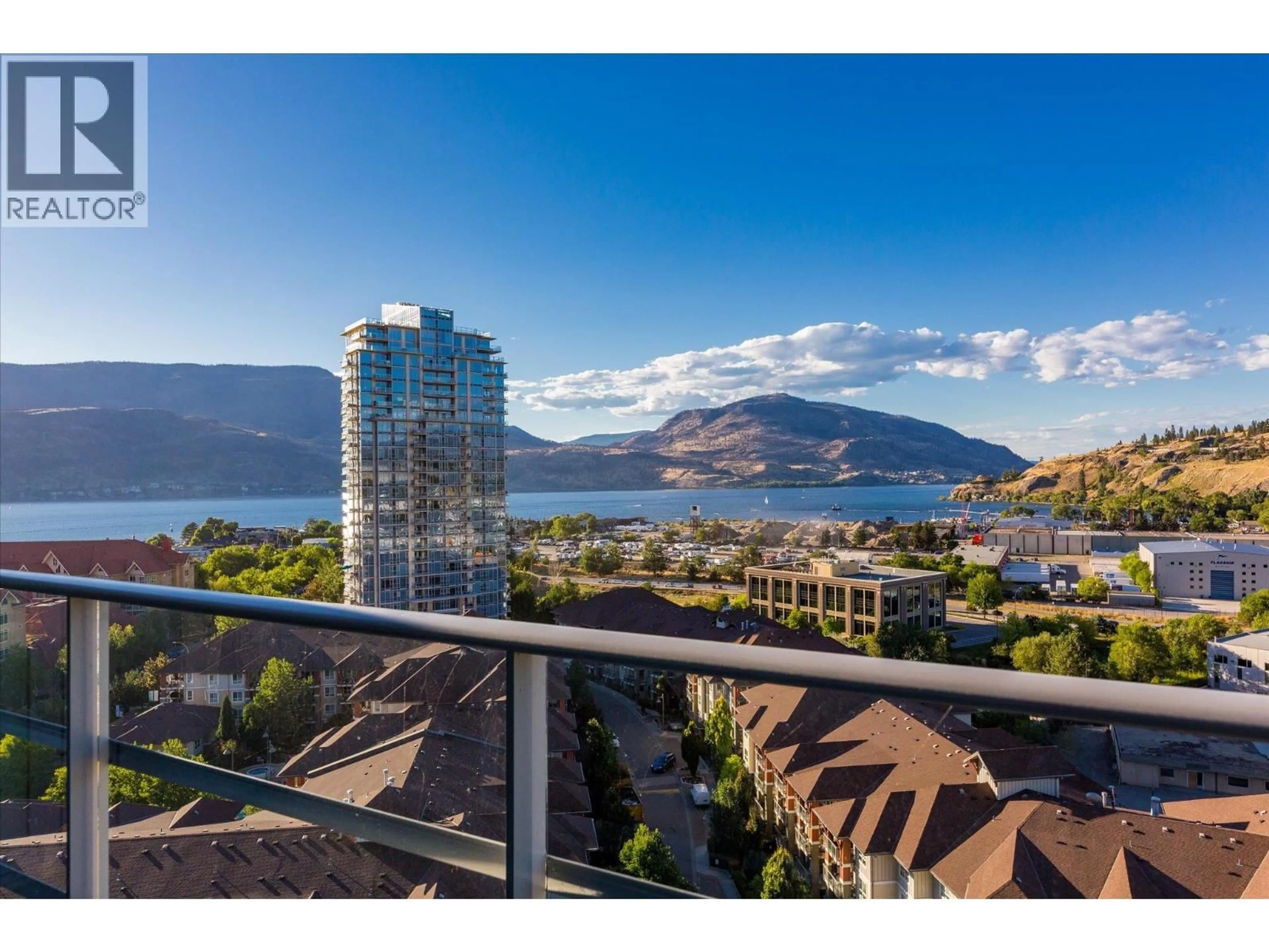 A pic from outside/outdoor area/front of a property/back of a property/a pic from drone, water/lake/river/ocean view for 1304 - 1151 SUNSET DRIVE, Kelowna British Columbia V1Y0G2