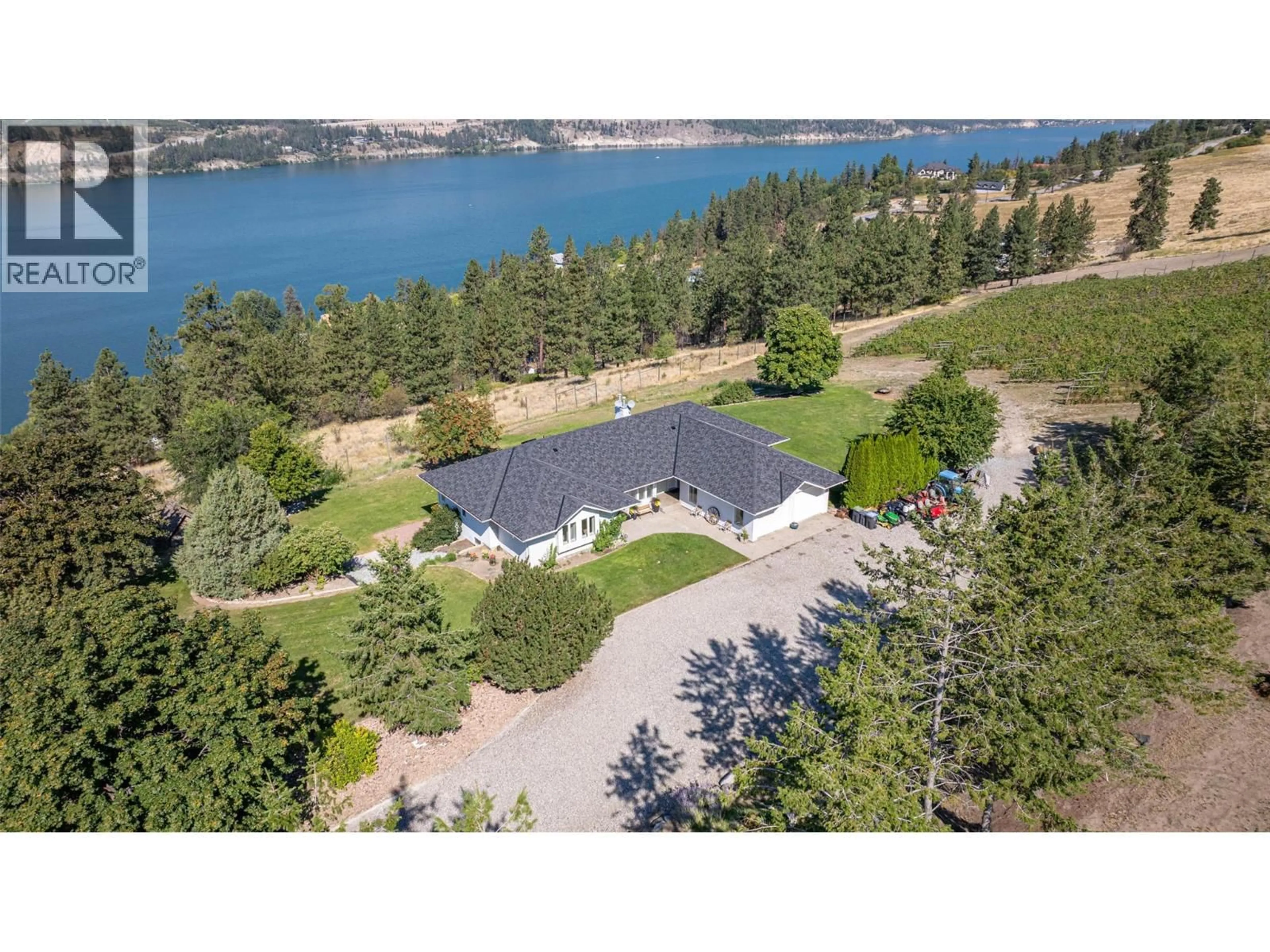 A pic from outside/outdoor area/front of a property/back of a property/a pic from drone, water/lake/river/ocean view for 4491 HEBBERT ROAD, Lake Country British Columbia V4V2A8