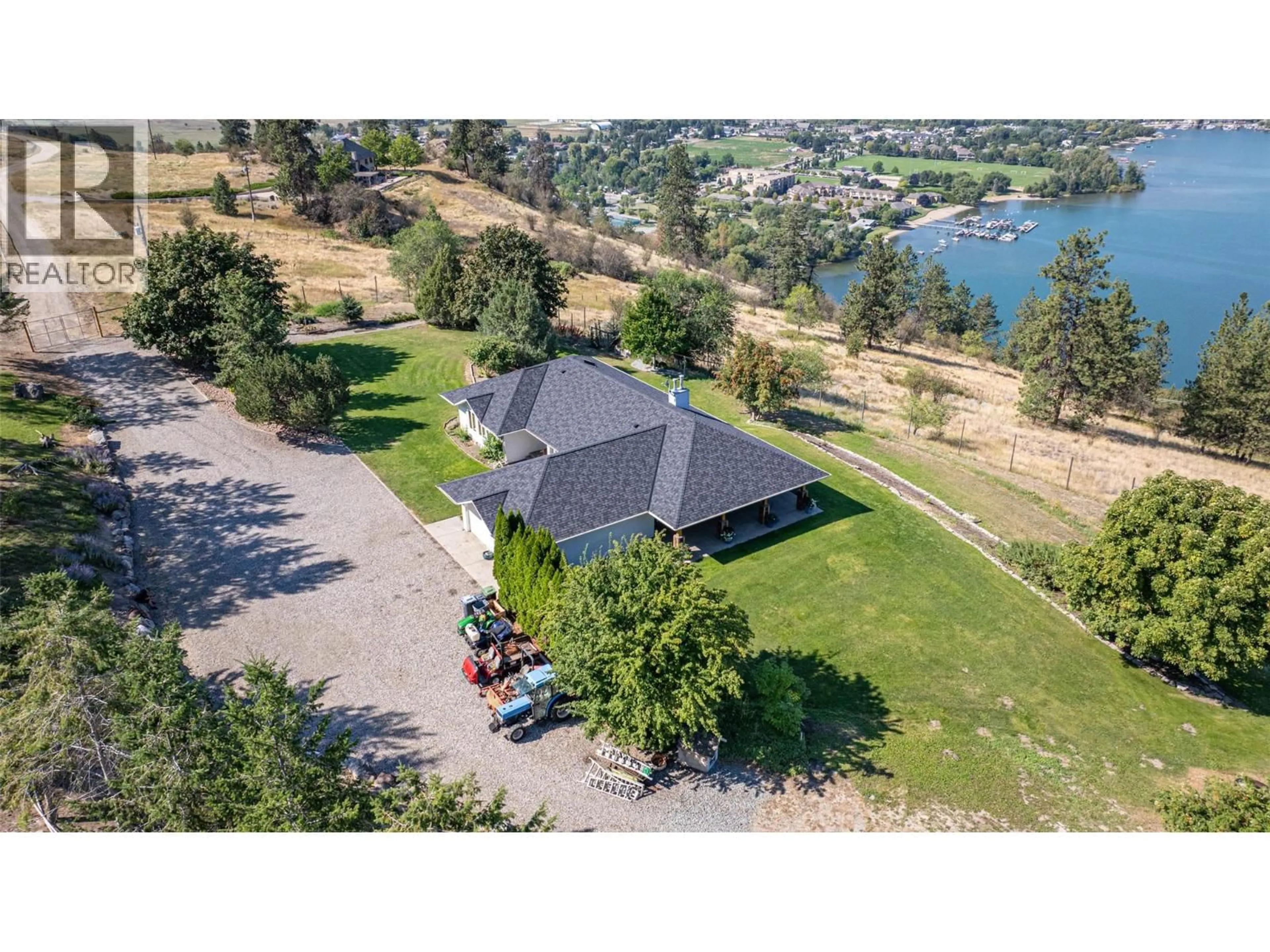 A pic from outside/outdoor area/front of a property/back of a property/a pic from drone, water/lake/river/ocean view for 4491 HEBBERT ROAD, Lake Country British Columbia V4V2A8