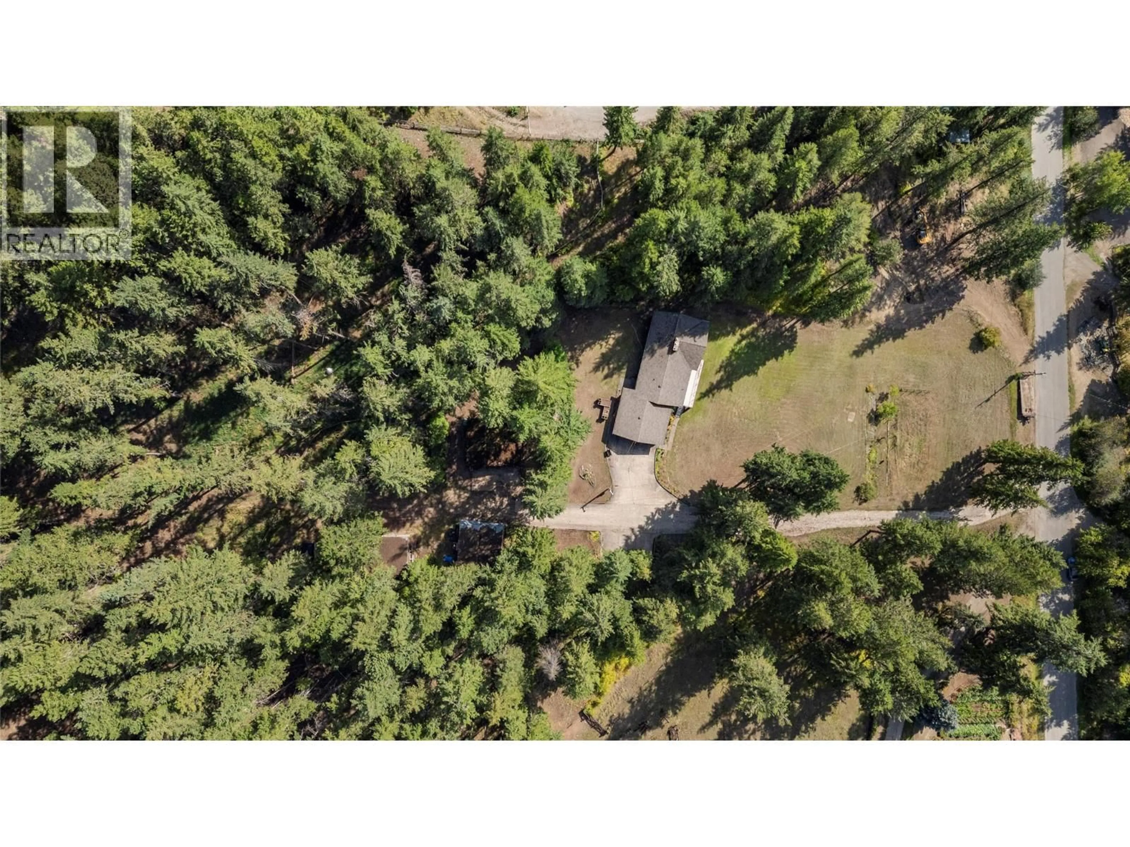 A pic from outside/outdoor area/front of a property/back of a property/a pic from drone, forest/trees view for 1476 VELLA ROAD, Tappen British Columbia V0E2X2