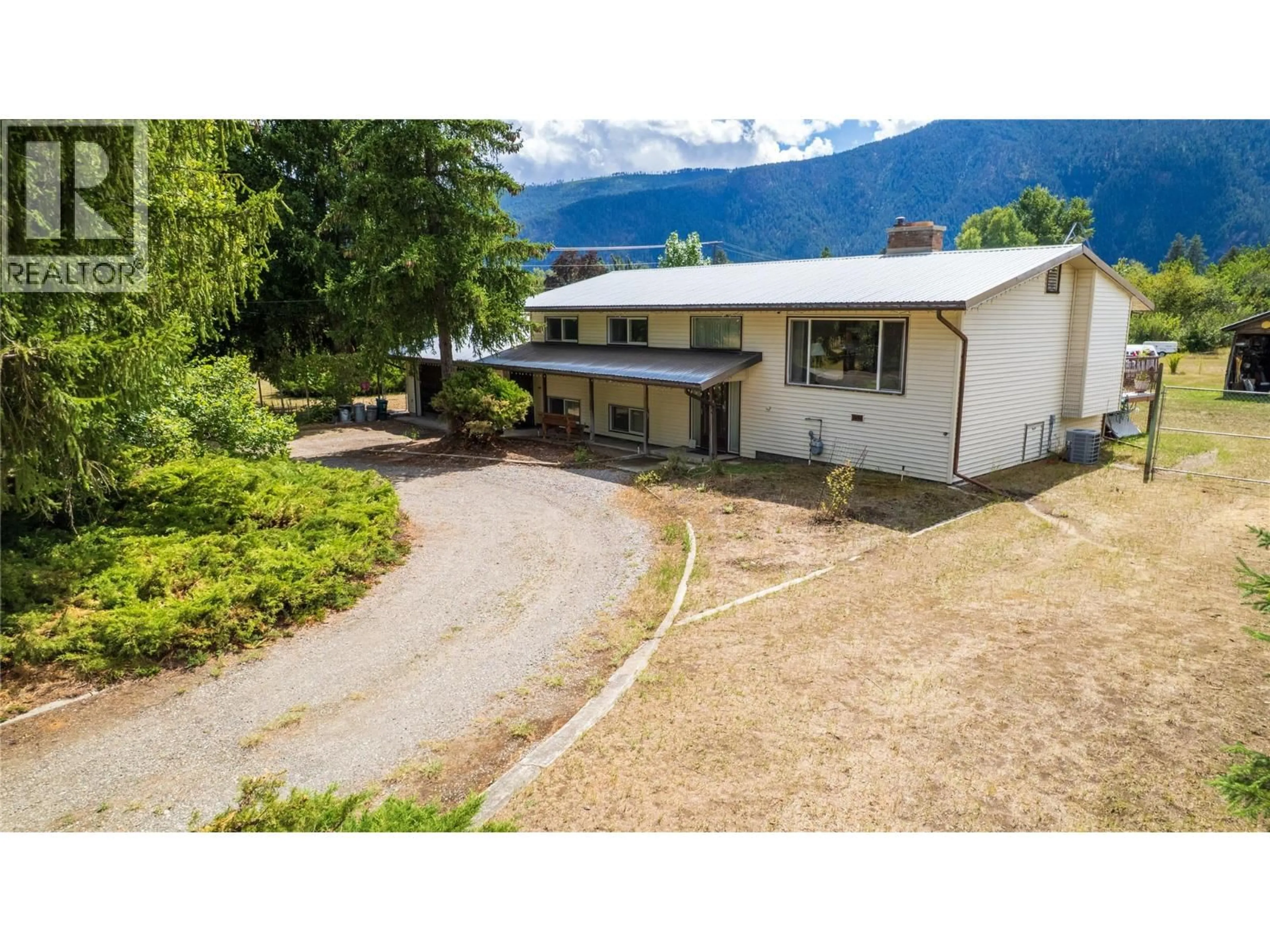 A pic from outside/outdoor area/front of a property/back of a property/a pic from drone, mountain view for 1270 59 AVENUE, Grand Forks British Columbia V0H1H0
