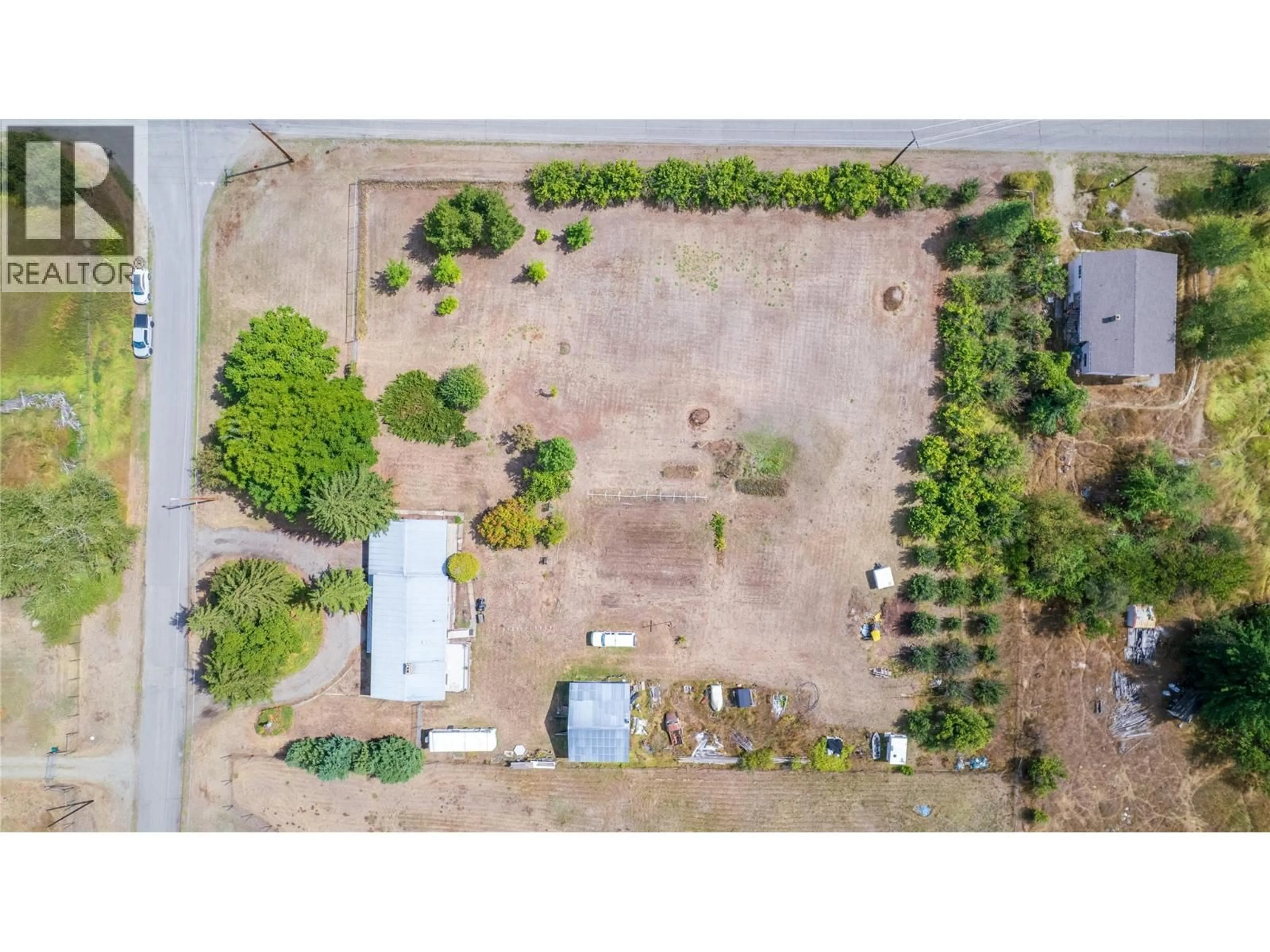 A pic from outside/outdoor area/front of a property/back of a property/a pic from drone, street for 1270 59 AVENUE, Grand Forks British Columbia V0H1H0
