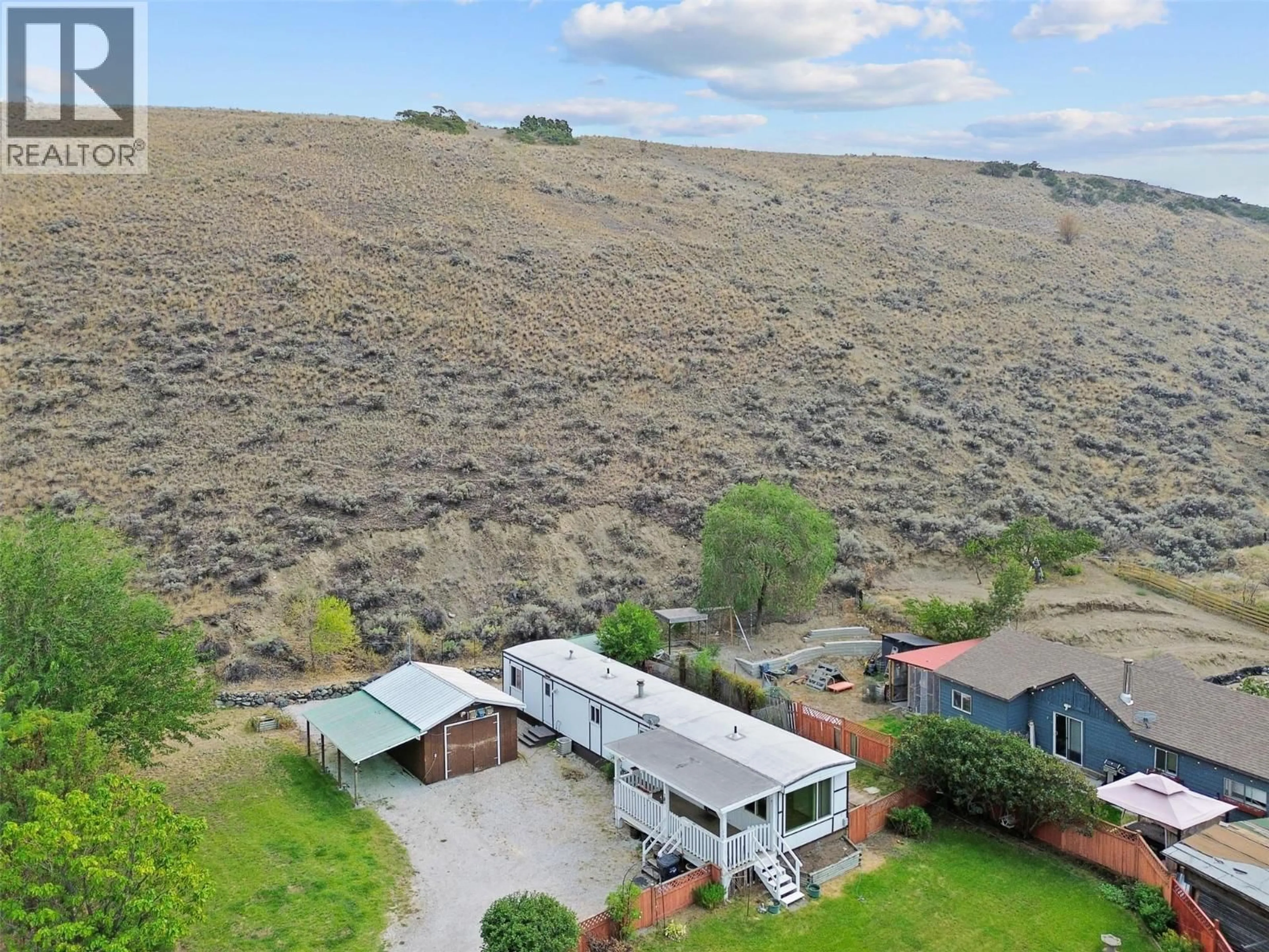 A pic from outside/outdoor area/front of a property/back of a property/a pic from drone, mountain view for 102 BARNES ROAD, Ashcroft British Columbia V0K2P0