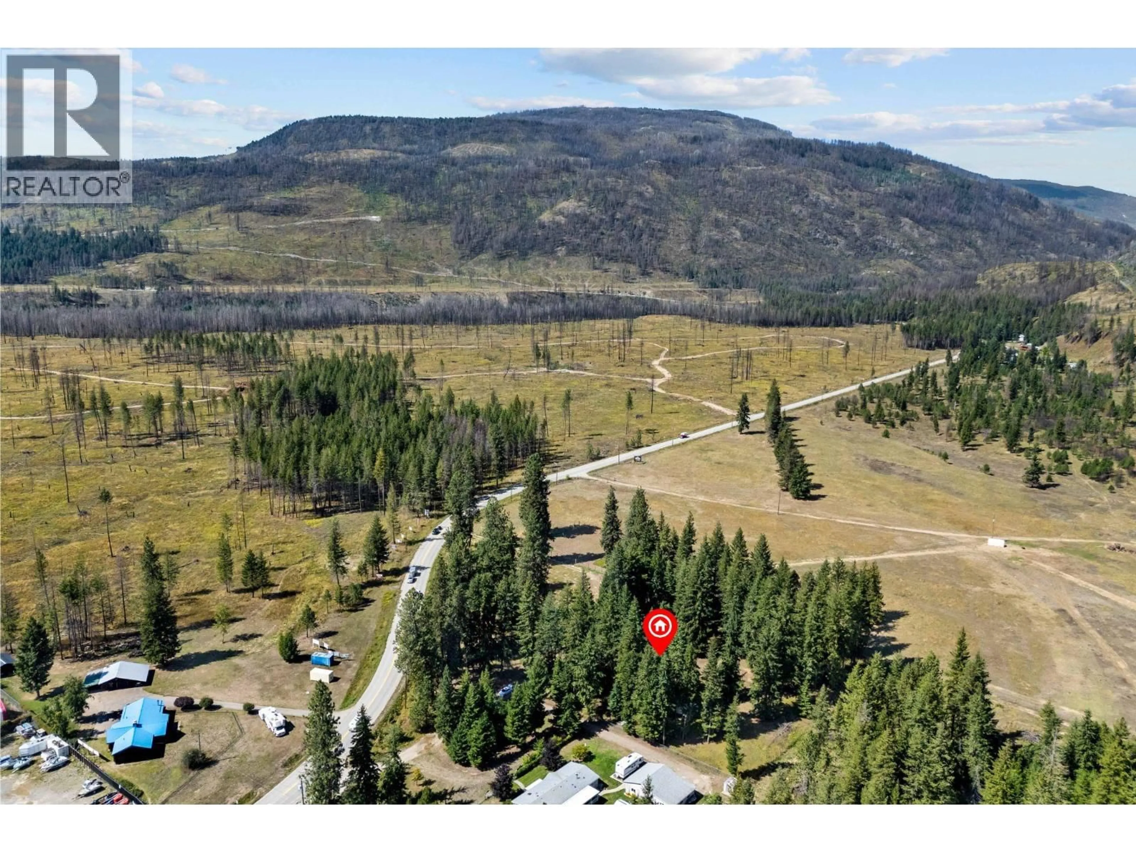 A pic from outside/outdoor area/front of a property/back of a property/a pic from drone, mountain view for 1434 BEATTY ROAD, Scotch Creek British Columbia V0E1M5