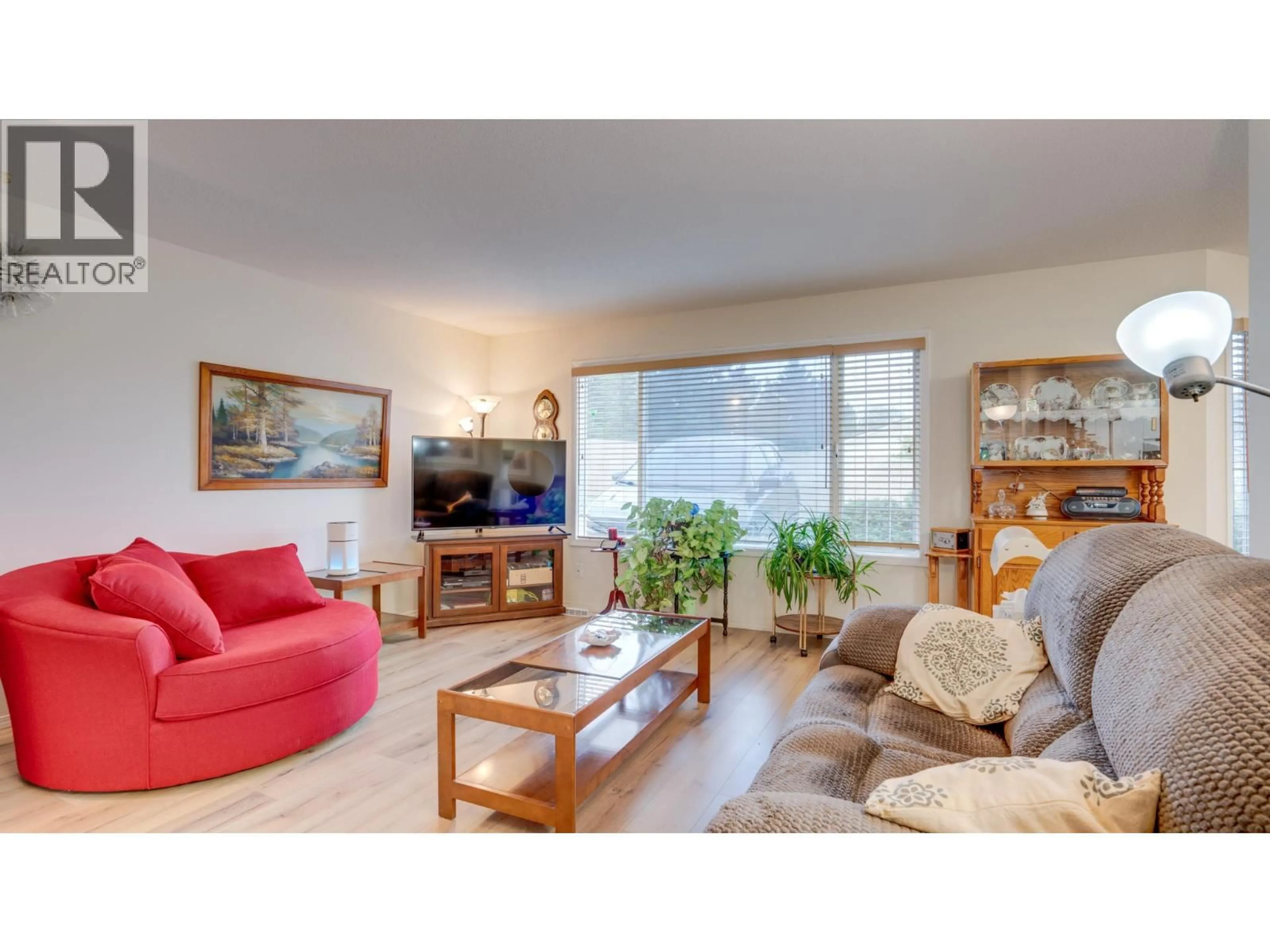 Living room with furniture, wood/laminate floor for 38 - 4600 BELLA VISTA ROAD, Vernon British Columbia V1T2N4