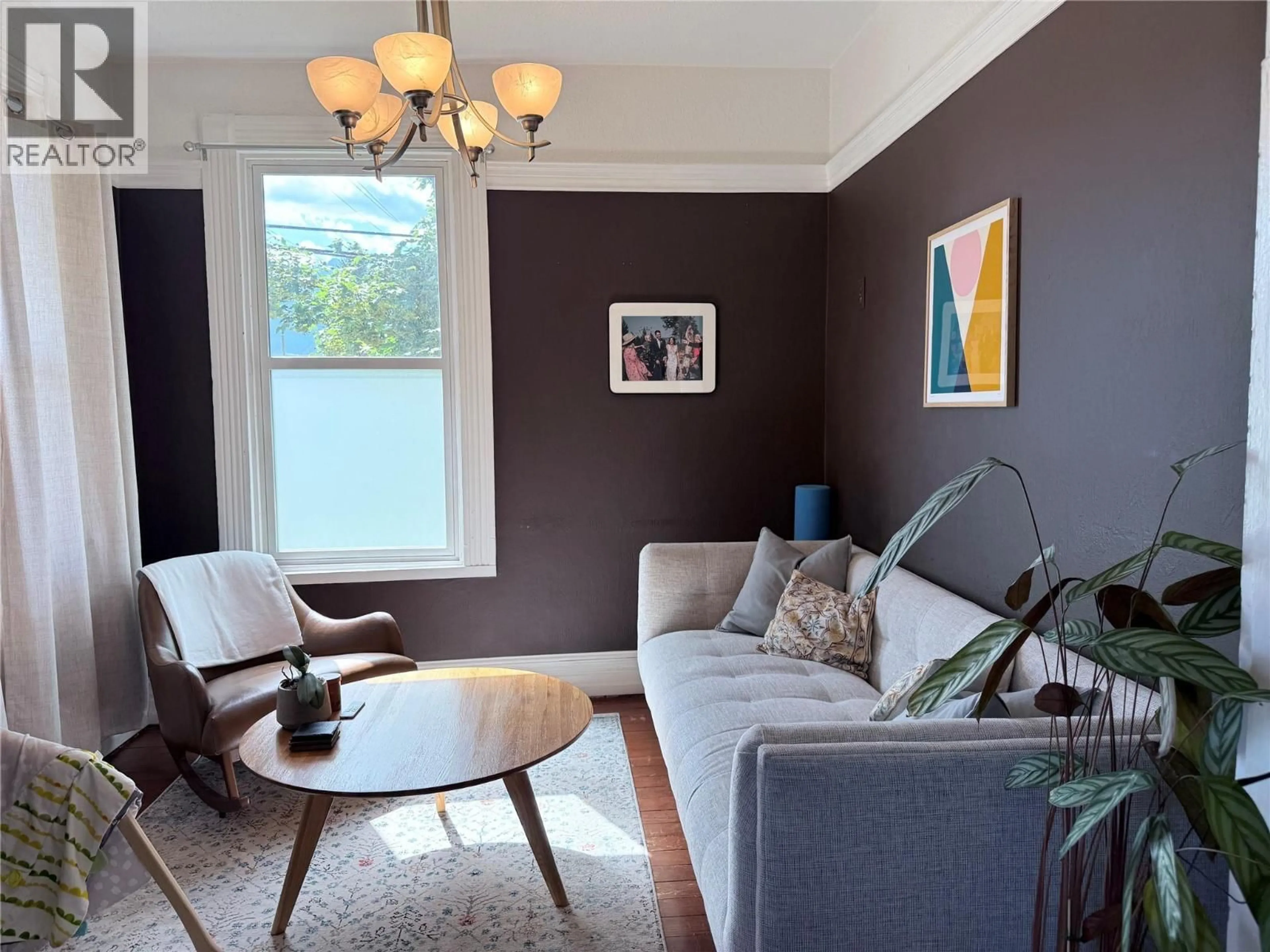 Living room with furniture, wood/laminate floor for 415 DOWNIE STREET, Revelstoke British Columbia V0E2S0