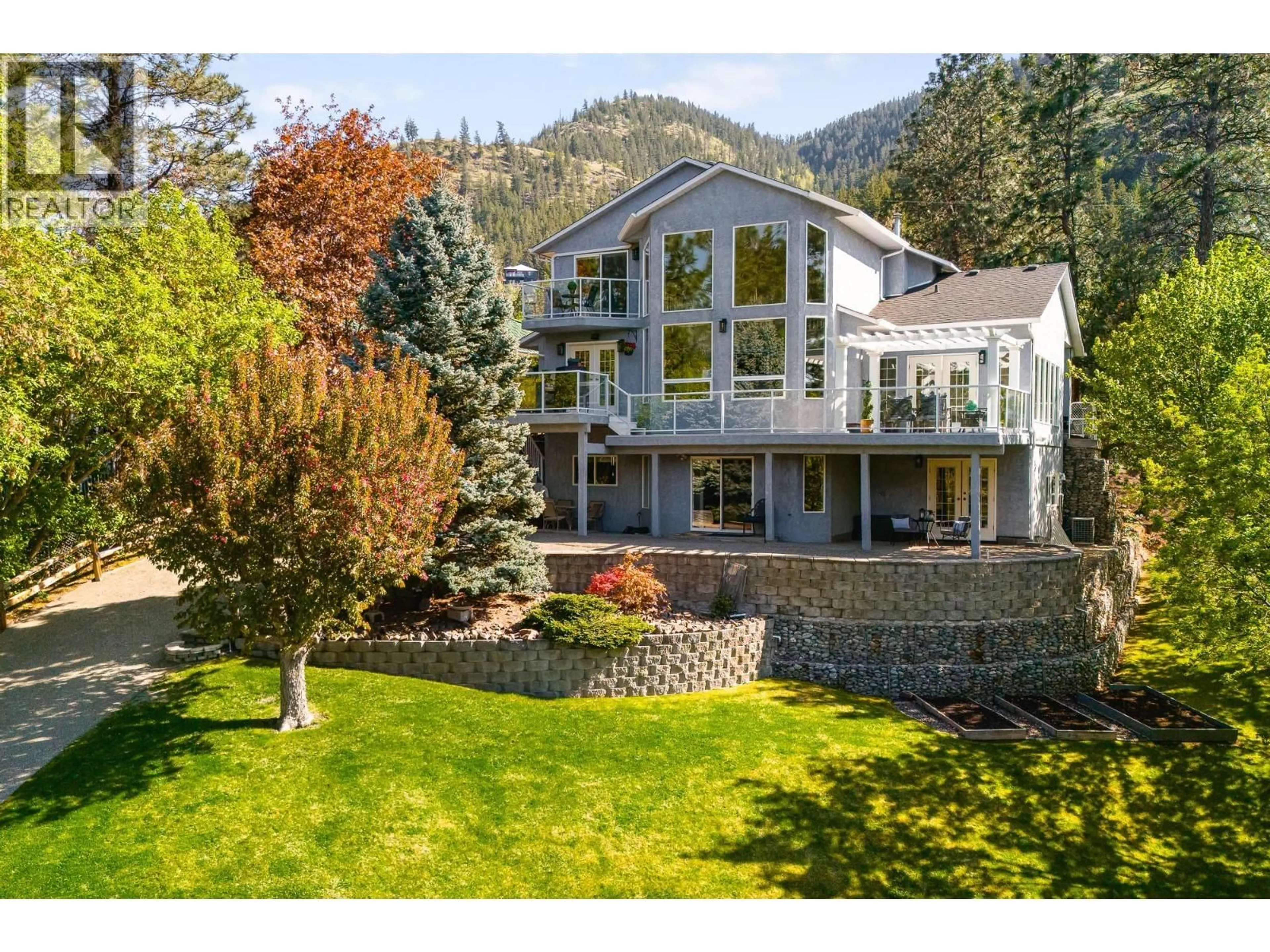 A pic from outside/outdoor area/front of a property/back of a property/a pic from drone, mountain view for 4938 UPLANDS DRIVE, Kamloops British Columbia V2C6M8