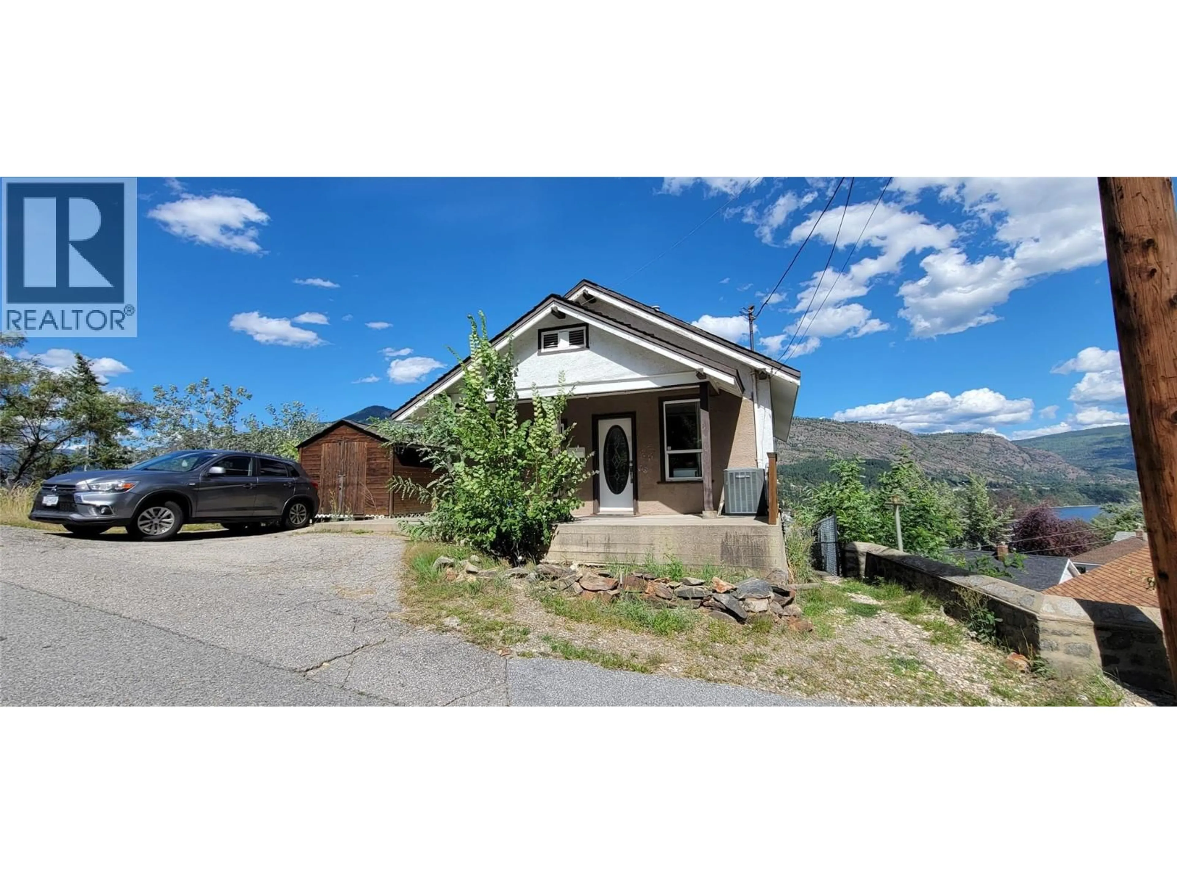 A pic from outside/outdoor area/front of a property/back of a property/a pic from drone, mountain view for 1553 DIAMOND STREET, Trail British Columbia V1R4H5