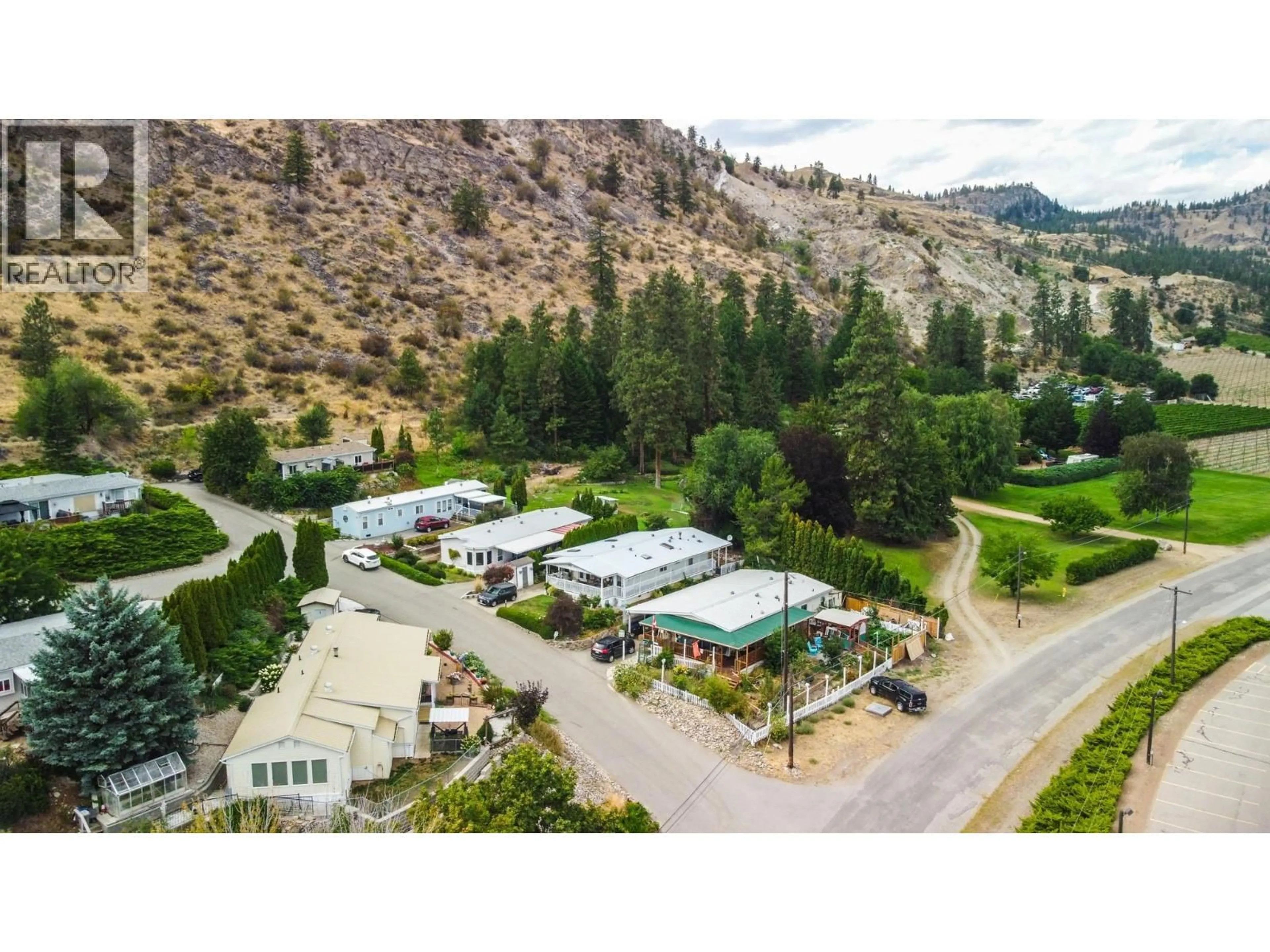 A pic from outside/outdoor area/front of a property/back of a property/a pic from drone, mountain view for 23 - 6822 LEIGHTON CRESCENT, Oliver British Columbia V0H1T2