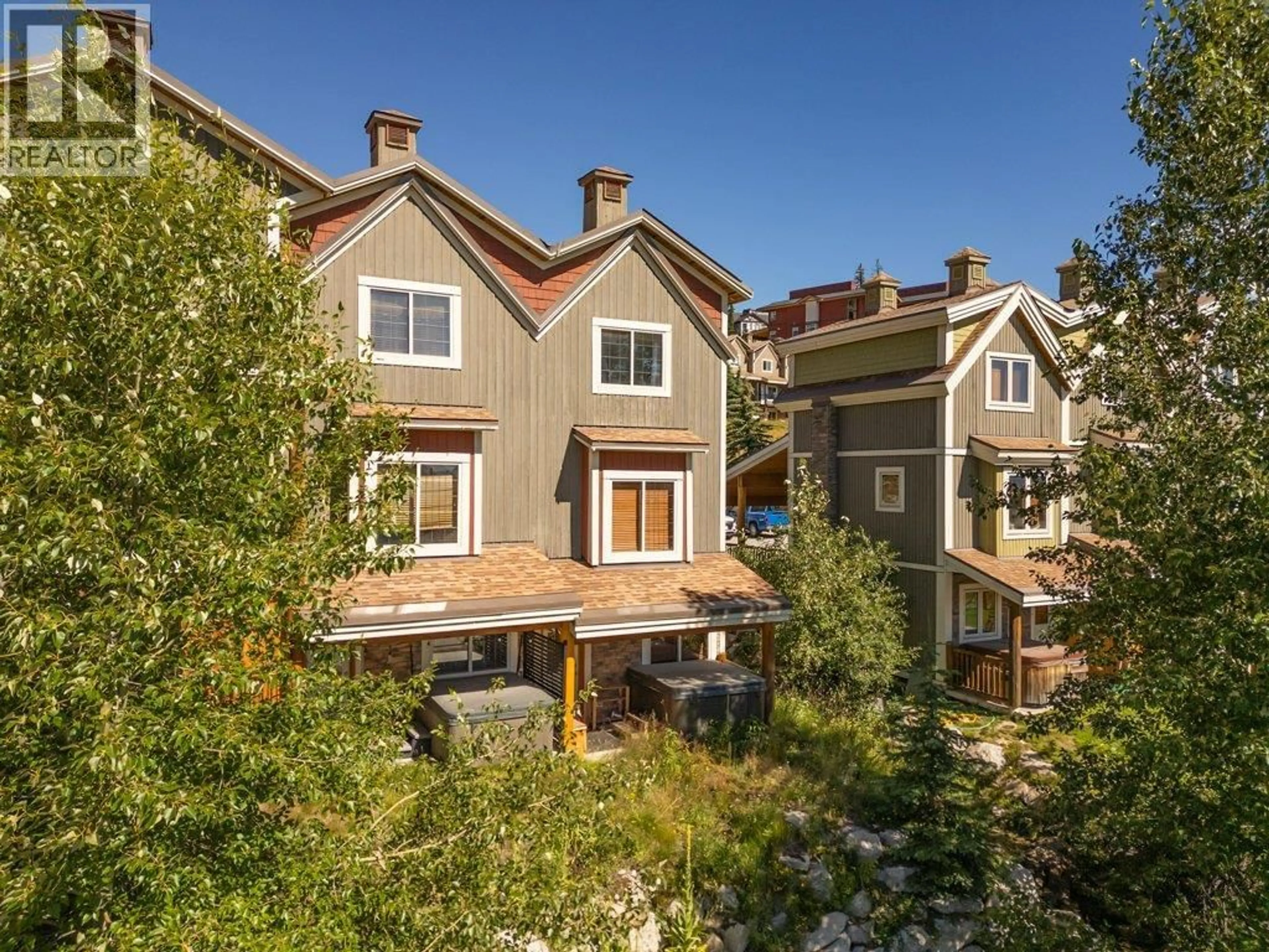 A pic from outside/outdoor area/front of a property/back of a property/a pic from drone, street for 3 - 5015 SNOWBIRD WAY, Big White British Columbia V1P1T4