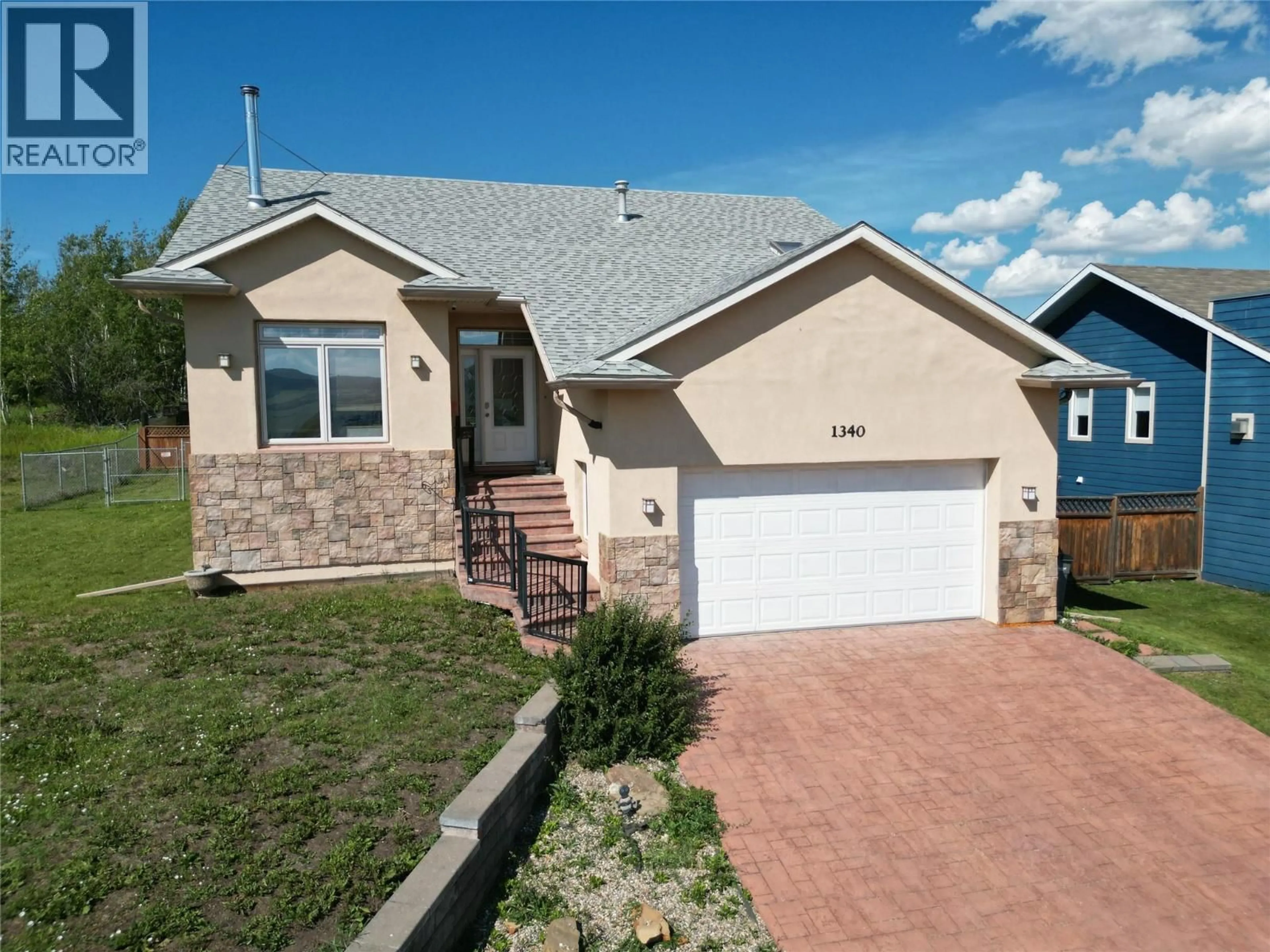 Home with vinyl exterior material, street for 1340 92 AVENUE, Dawson Creek British Columbia V1G1C3