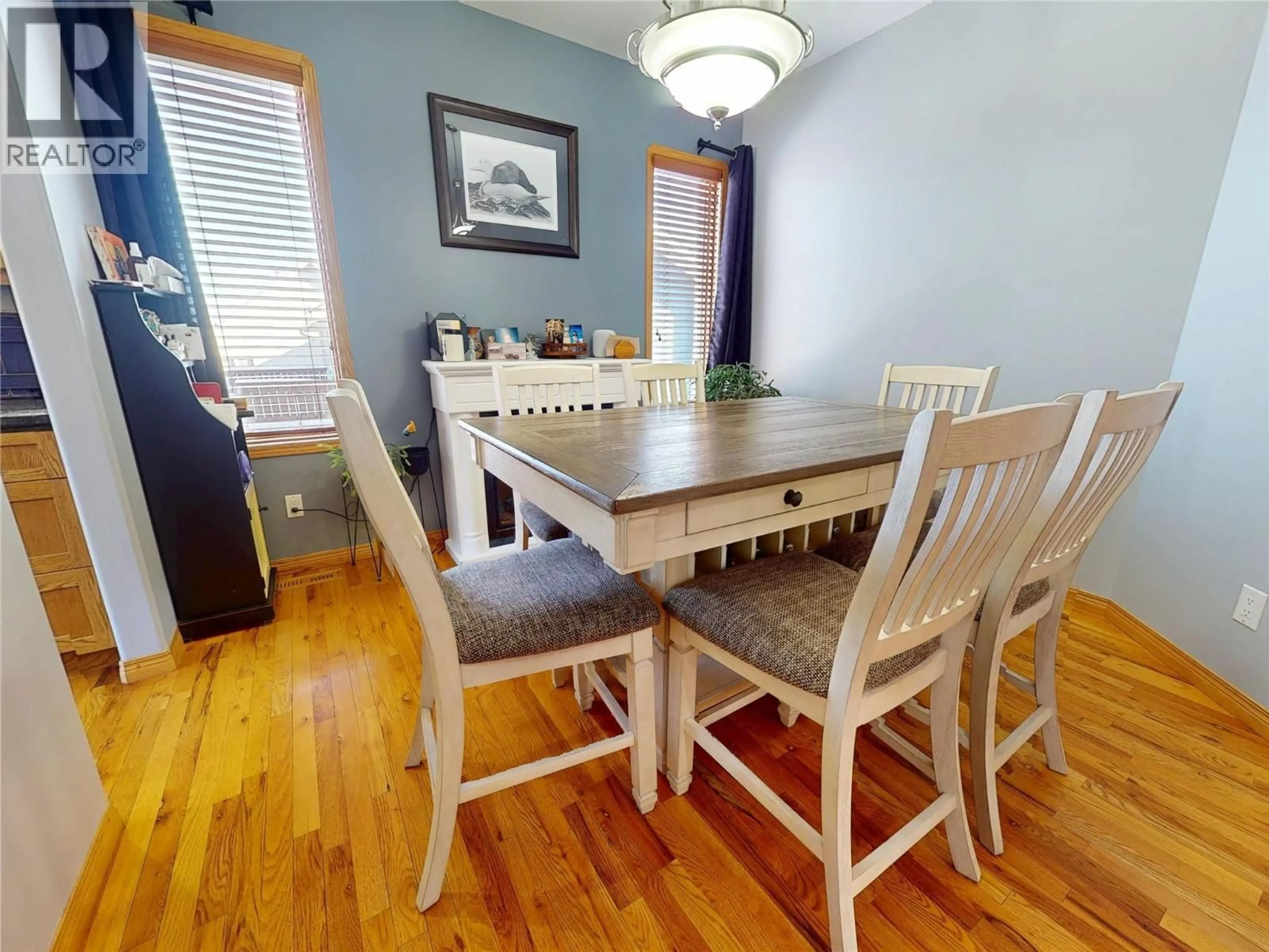 Dining room, wood/laminate floor for 1340 92 AVENUE, Dawson Creek British Columbia V1G1C3