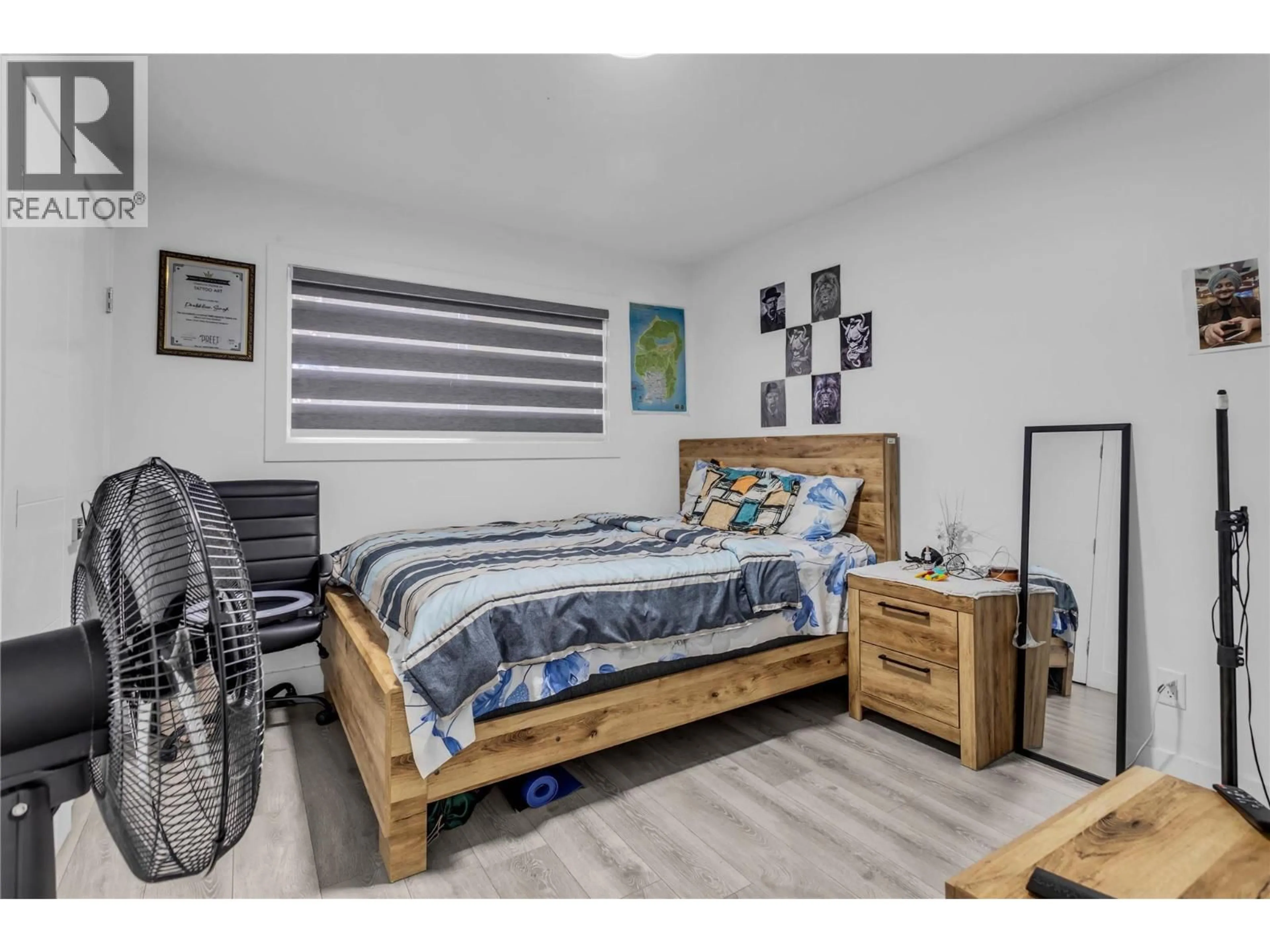 Bedroom with bed, wood/laminate floor for 4210 17 AVENUE, Vernon British Columbia V1T7K8