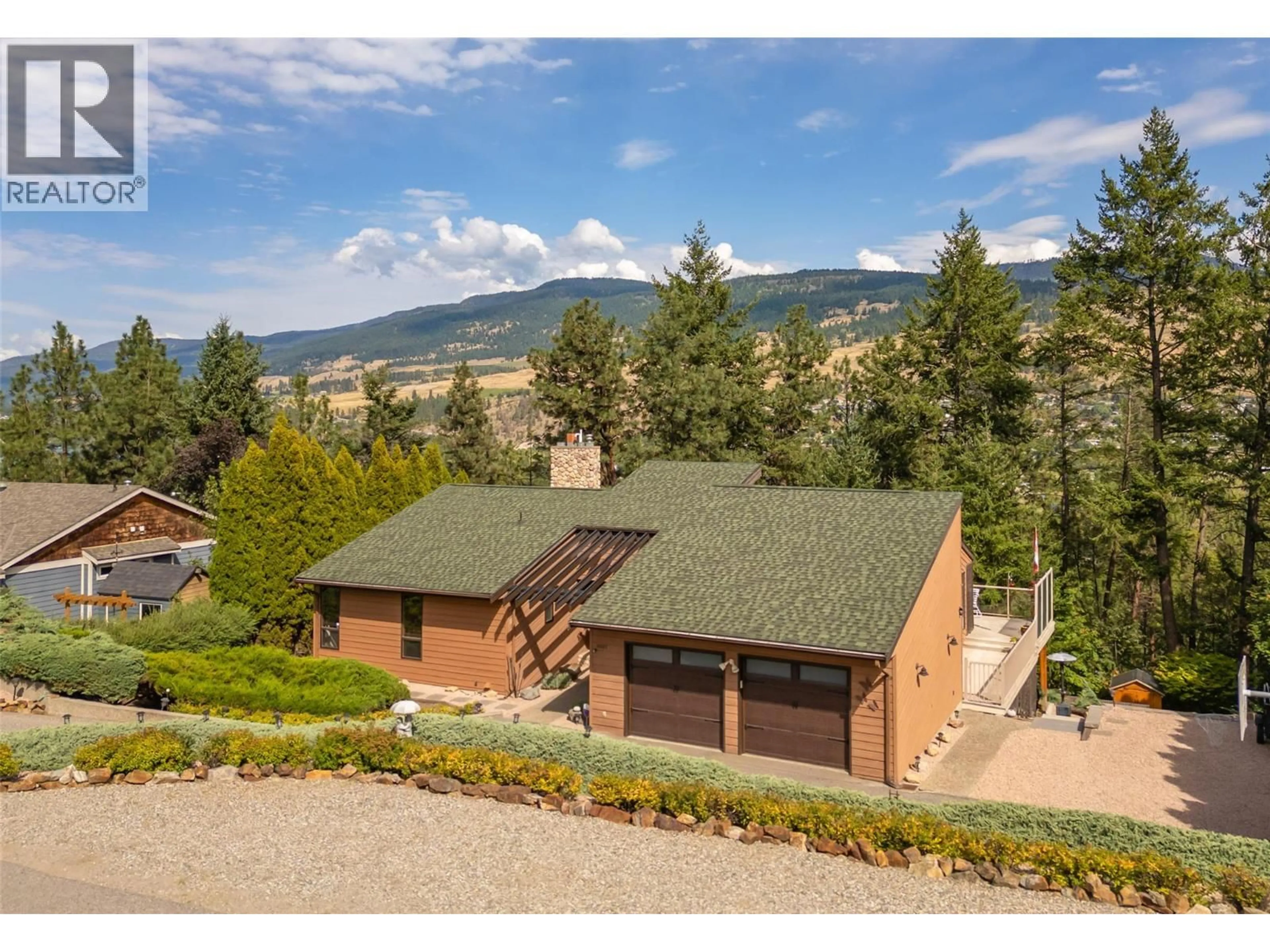 A pic from outside/outdoor area/front of a property/back of a property/a pic from drone, mountain view for 11027 EVA ROAD, Lake Country British Columbia V4V1H4