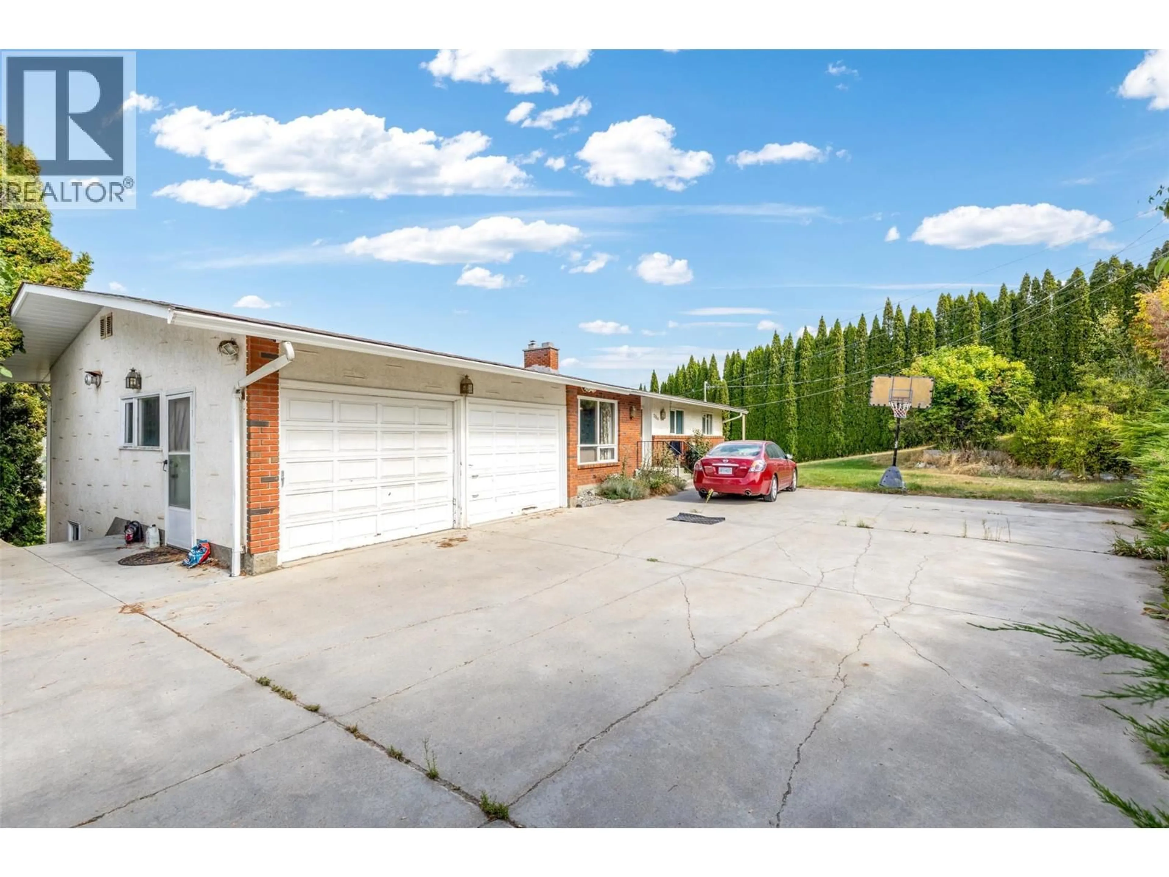 A pic from outside/outdoor area/front of a property/back of a property/a pic from drone, street for 2354 ROJEM ROAD, Kelowna British Columbia V1Y7P9