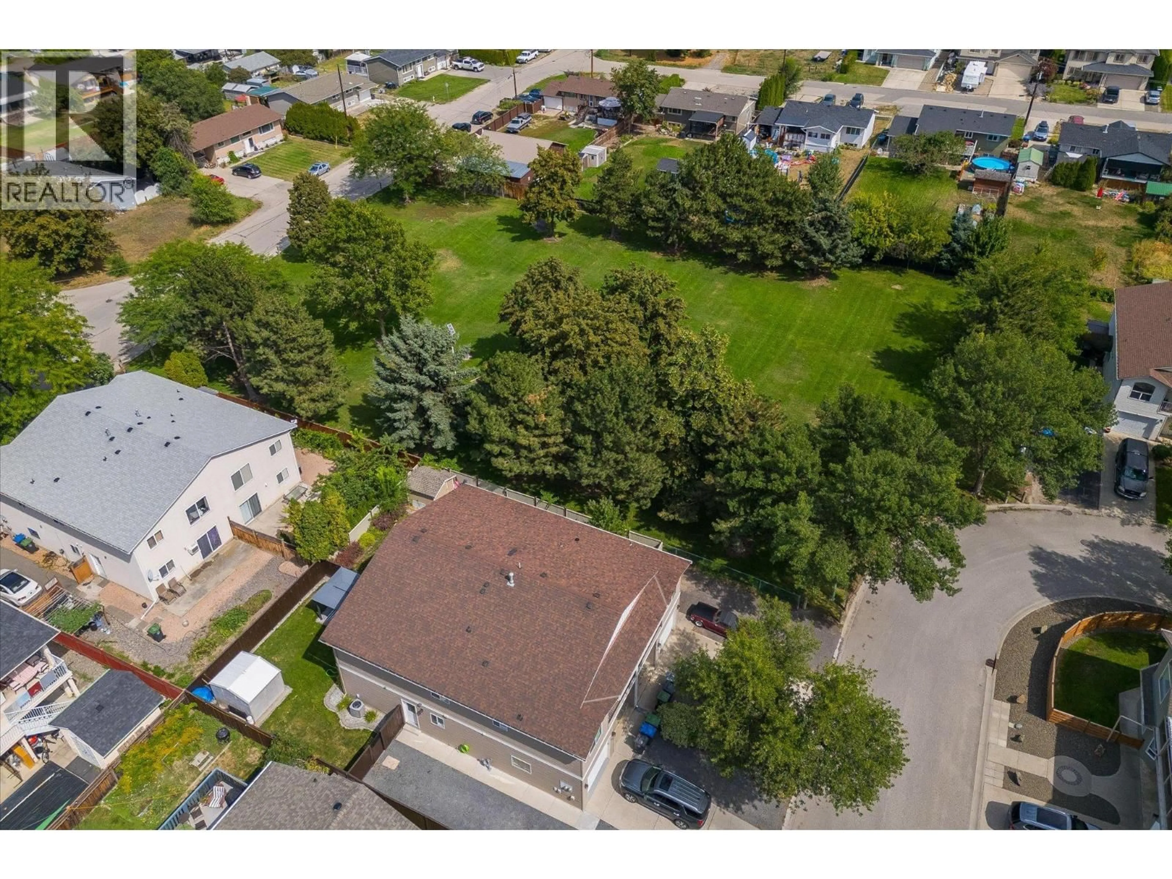 A pic from outside/outdoor area/front of a property/back of a property/a pic from drone, street for 442 WIGGLESWORTH CRESCENT, Kelowna British Columbia V1X7N1