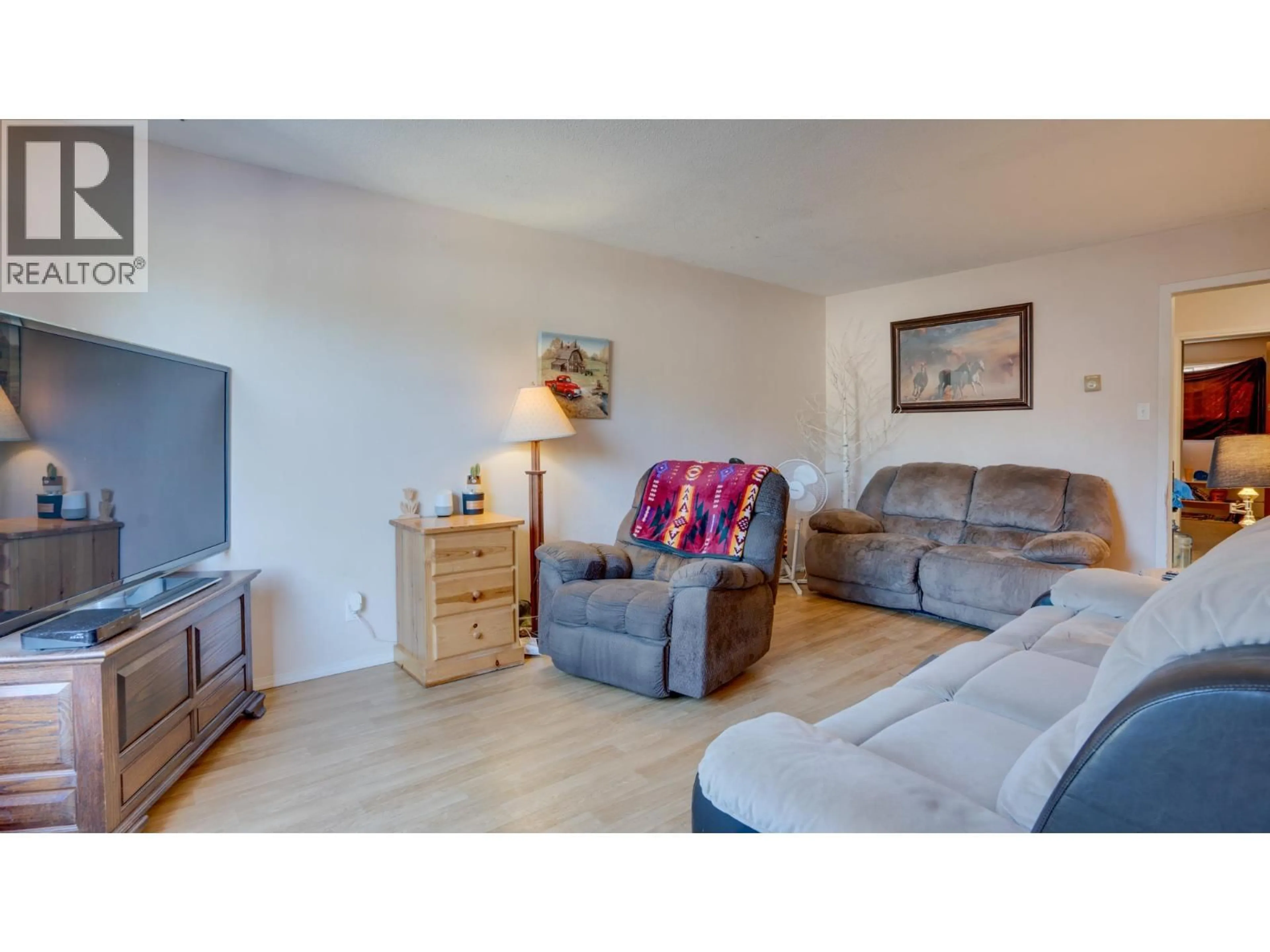 Living room with furniture, wood/laminate floor for 3303 BELAIRE DRIVE, Armstrong British Columbia V0E1B4