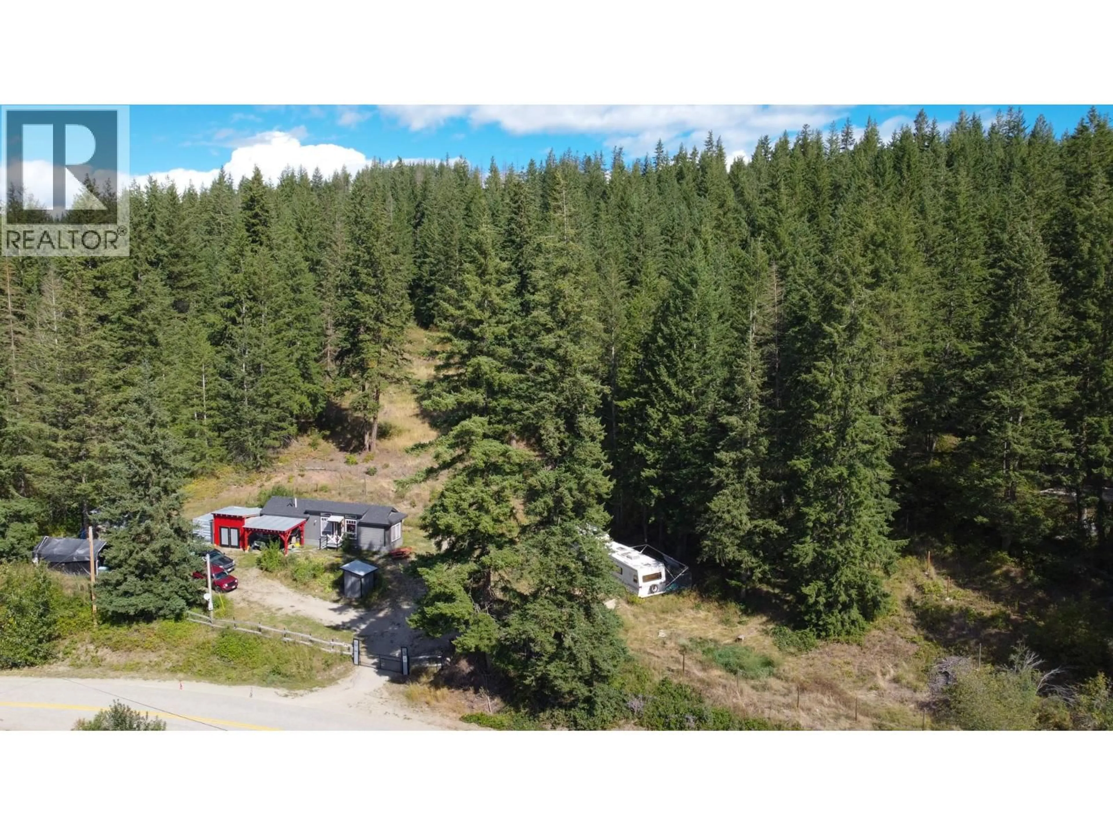 A pic from outside/outdoor area/front of a property/back of a property/a pic from drone, forest/trees view for 4050 WHITE LAKE ROAD, Tappen British Columbia V0E2W0