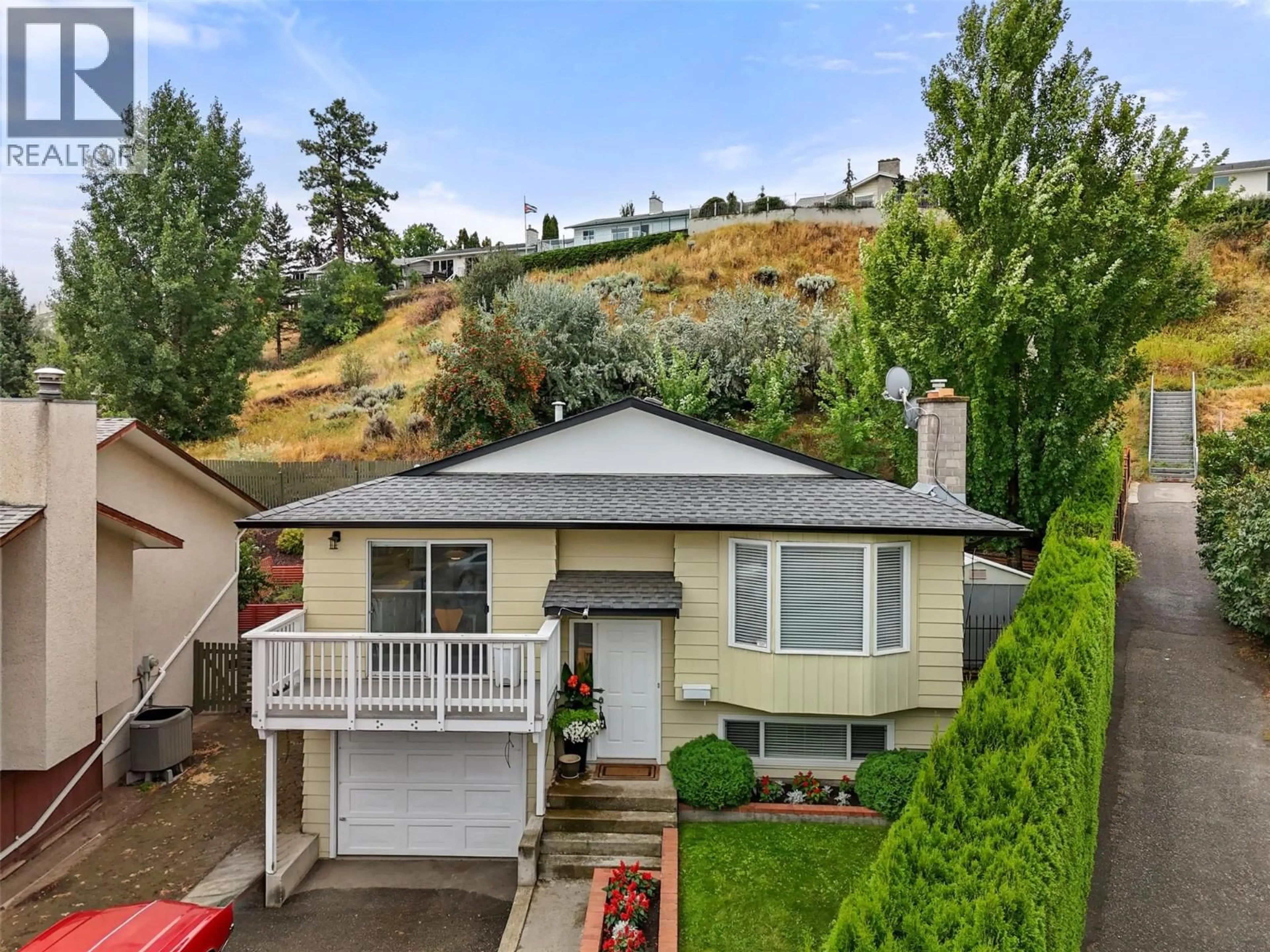 A pic from outside/outdoor area/front of a property/back of a property/a pic from drone, mountain view for 1289 MONASHEE COURT, Kamloops British Columbia V2C6B4